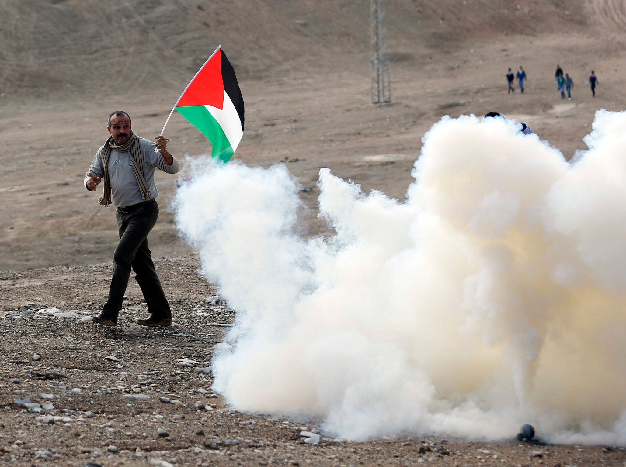 Protester with Palestinian flag in Hebron