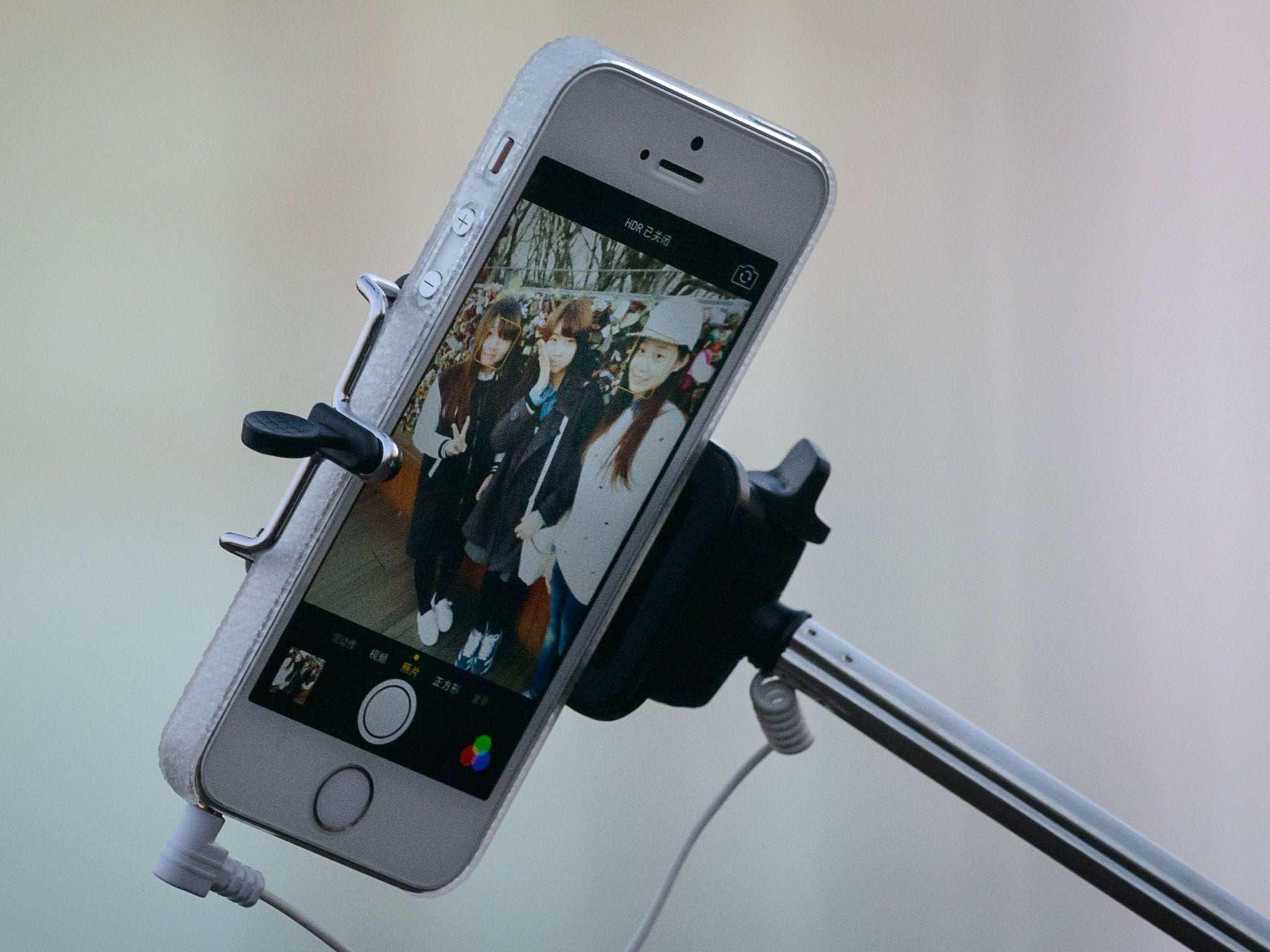 Selfie sticks allow people to take photos of themselves without having to ask passers-by