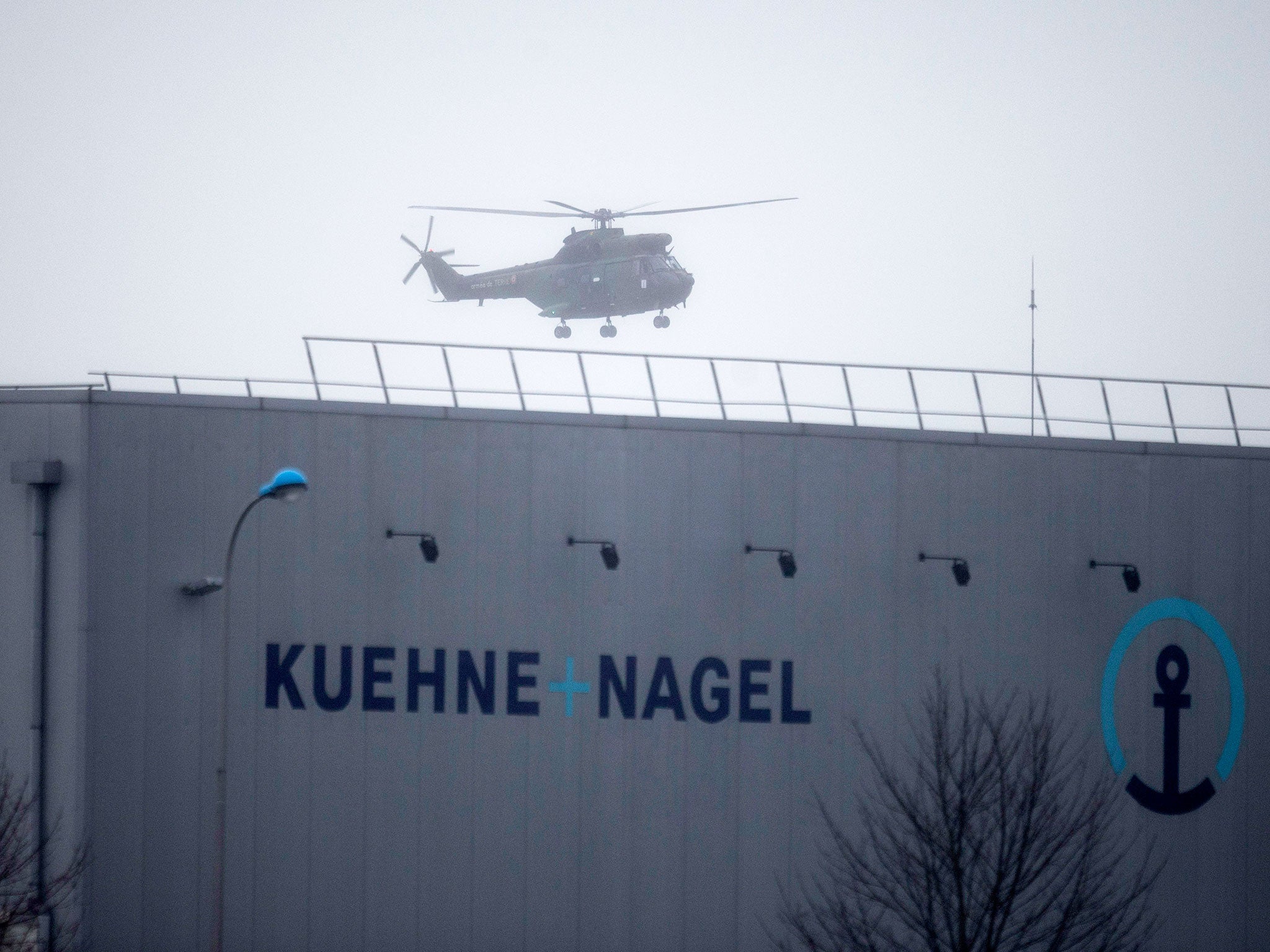 A military helicopter flies over Dammartin-en-Goele, northeast of Paris