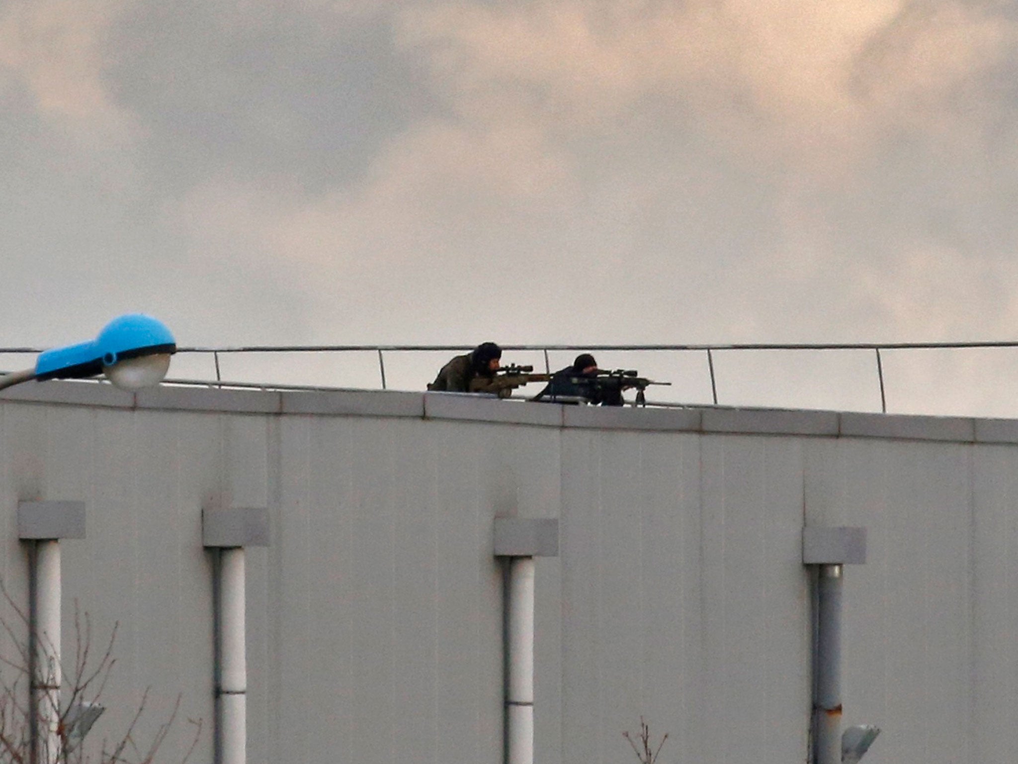 French special forces snipers surrounding the Kouachi brothers at a print works in Dammartin-en-Goele