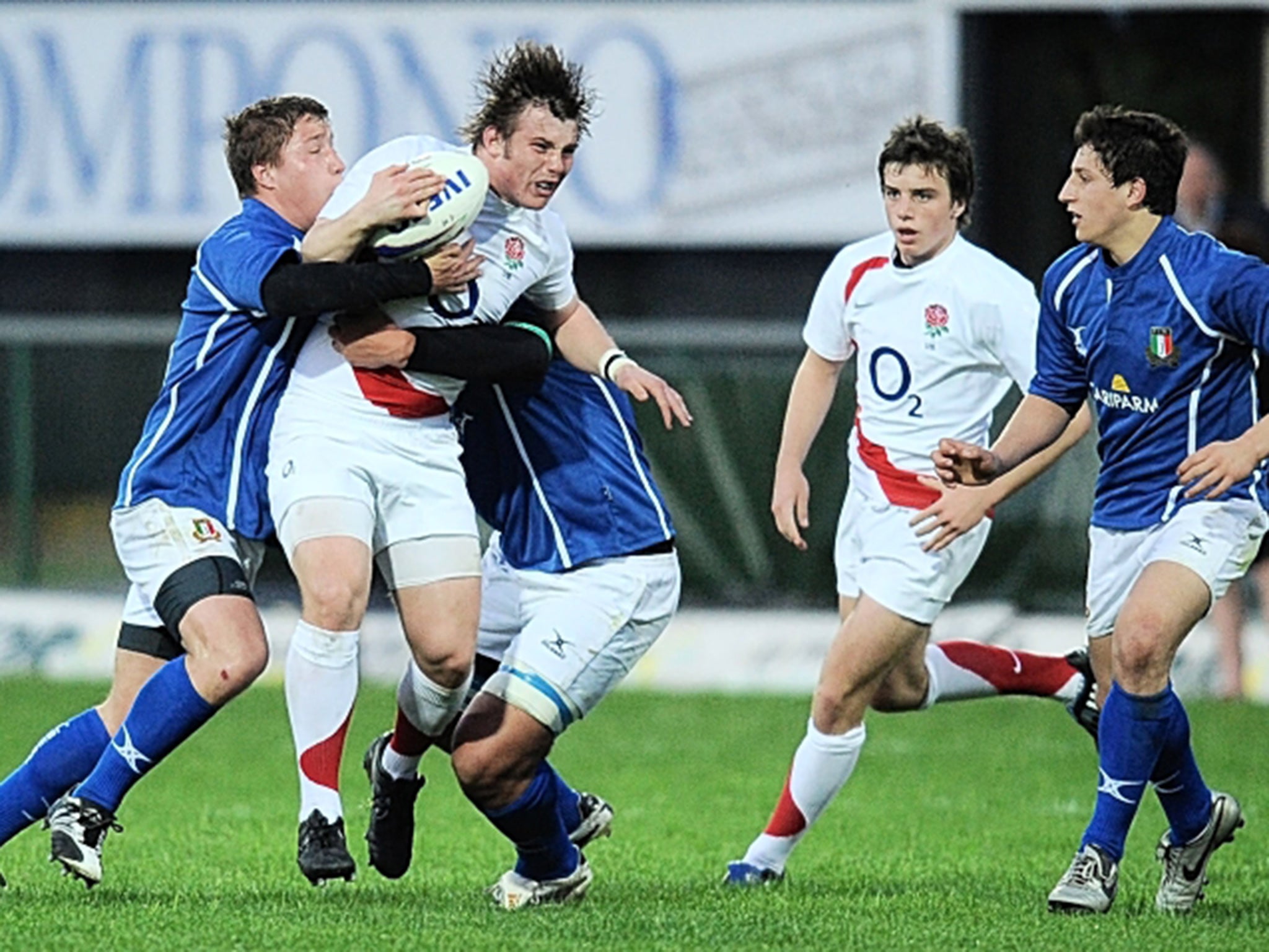 Allen is tackled, with George Ford in support, against Italy U-18s