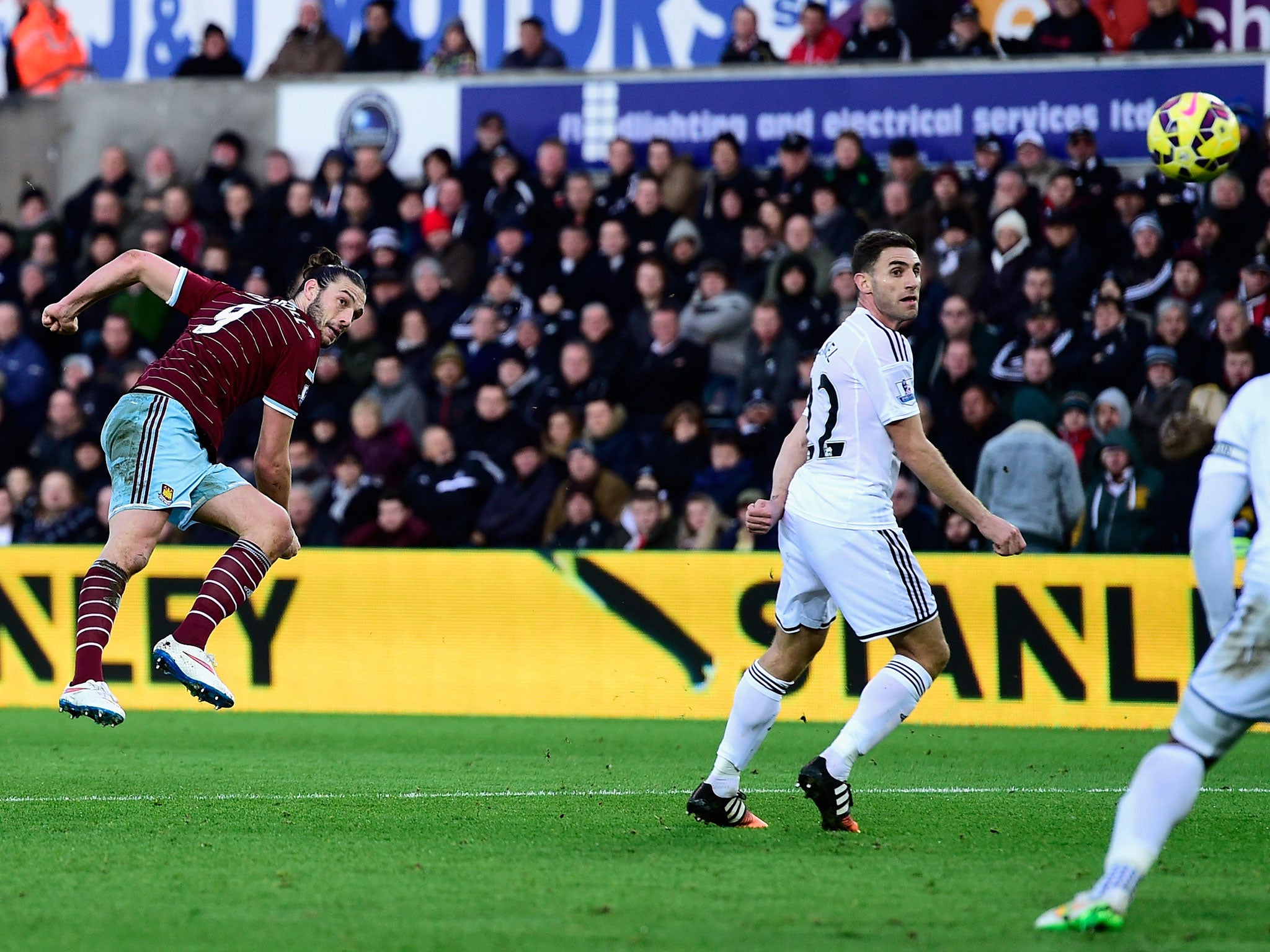 Carroll strikes the ball home from long range to put West Ham ahead