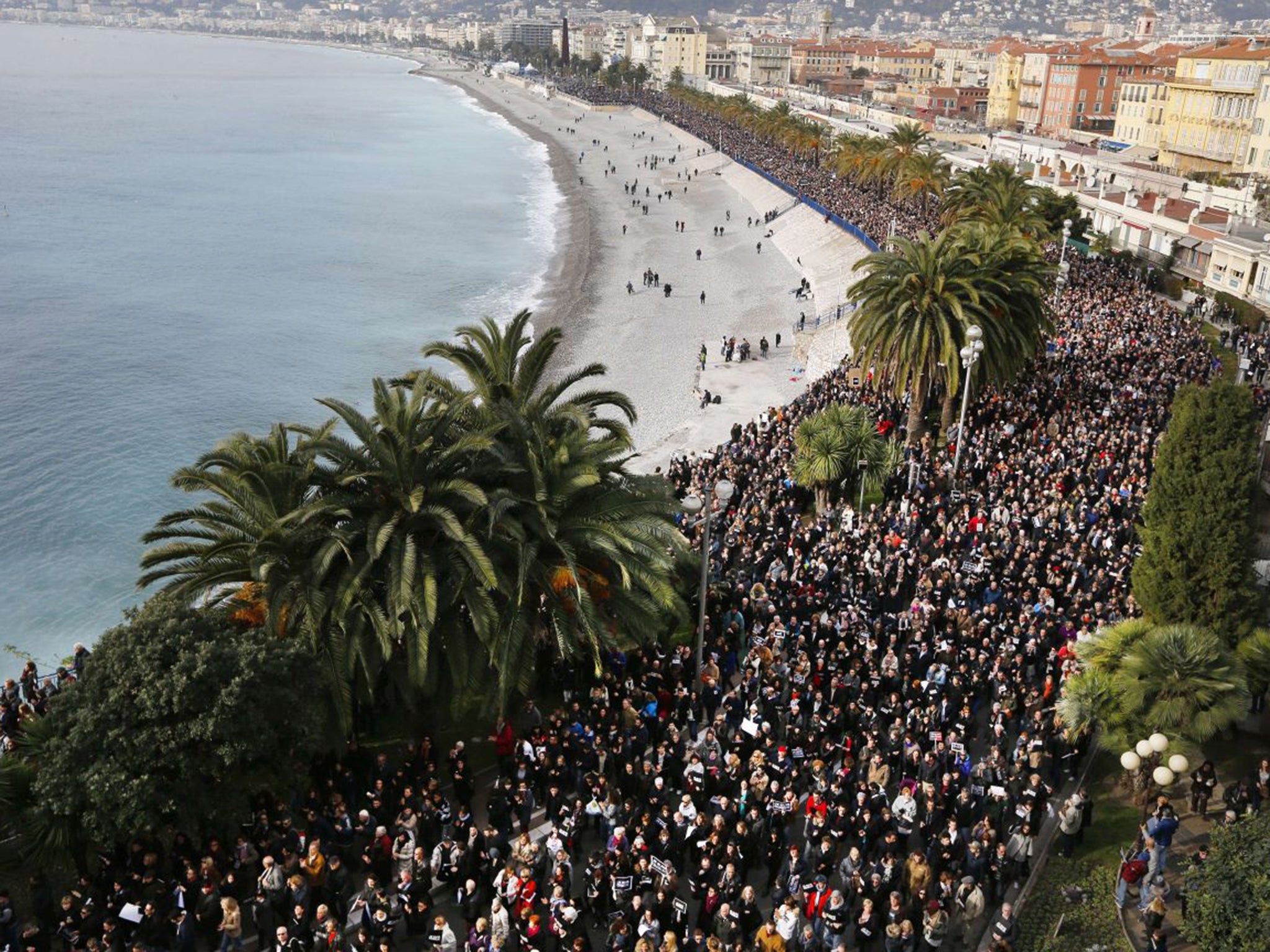 Hundreds of thousands of people march during a rally along the sea front in the Mediterranean city of Nice (AFP)