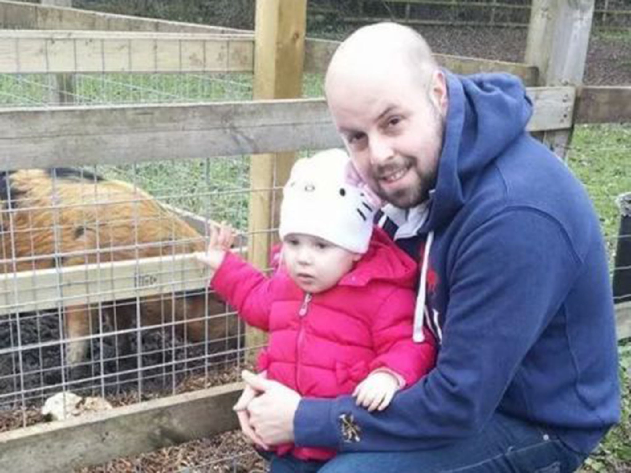 Staying at home: Stuart Greaves with his daughter, Emily, aged two