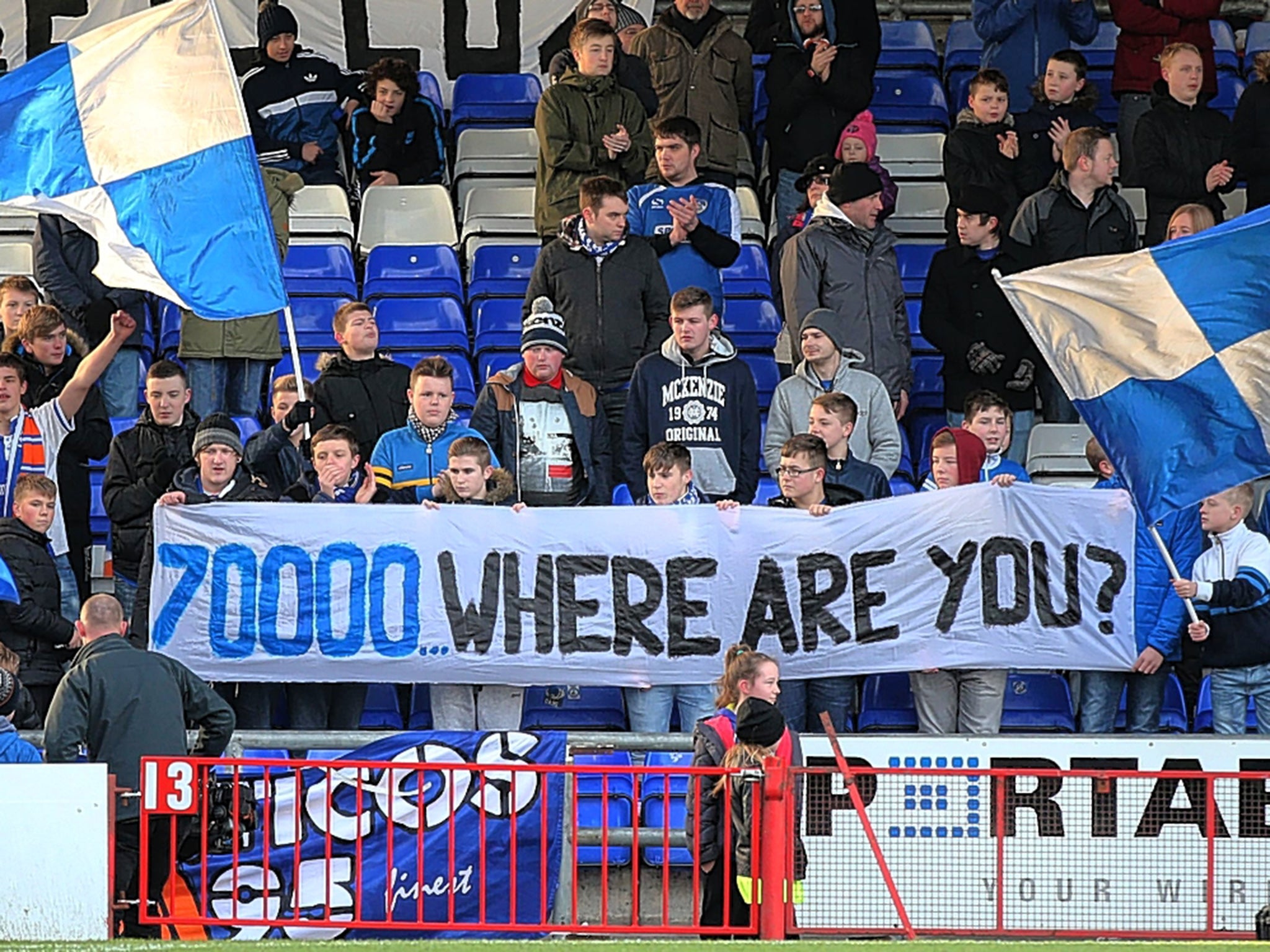 Oldham fans support their team at Boundary Park