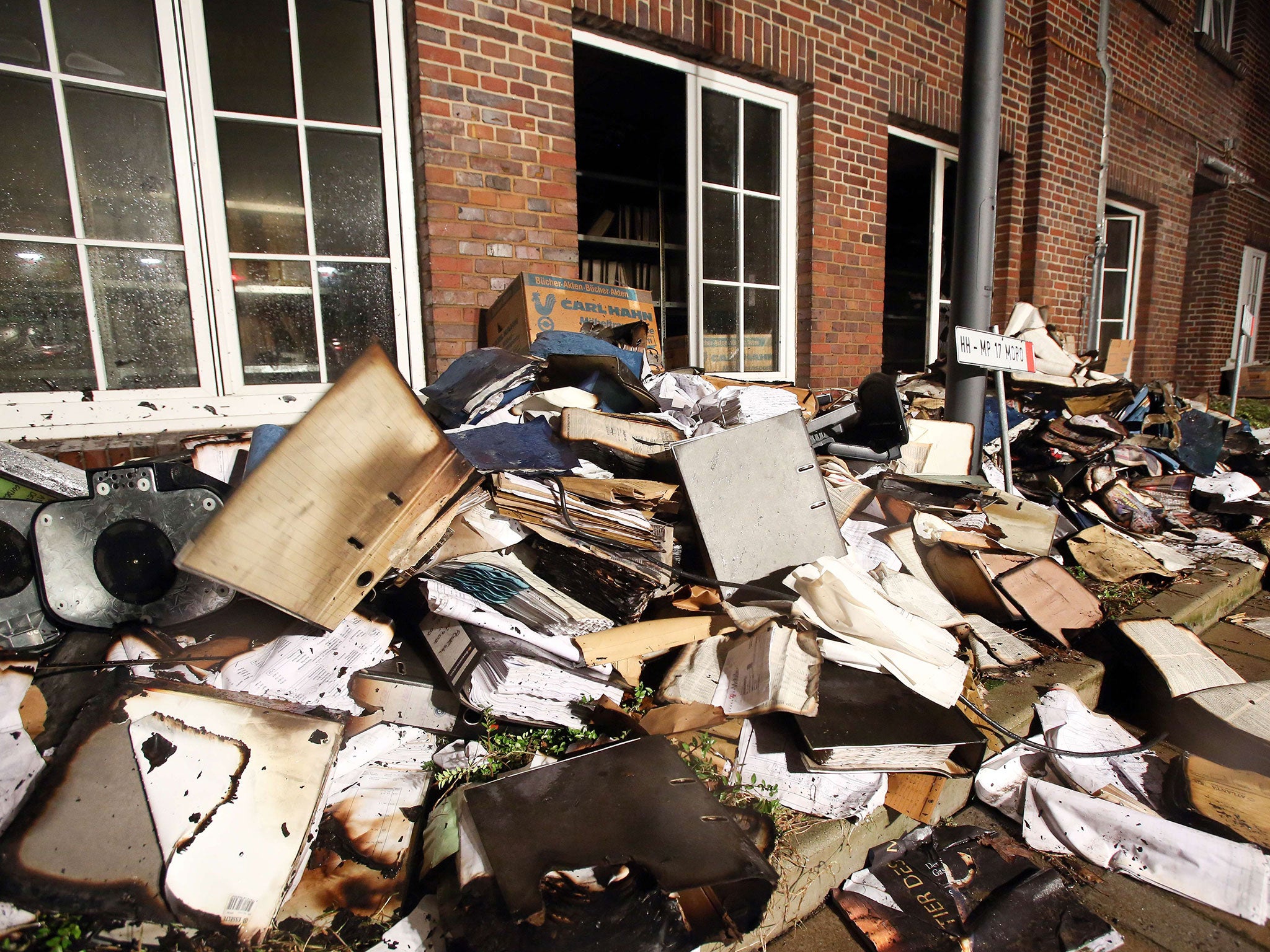 Burnt and damaged files are seen in the courtyard of German regional newspaper Hamburger Morgenpost editorial office in Hamburg, northern Germany, on January 11, 2015 after an arson attack (AFP/Getty)