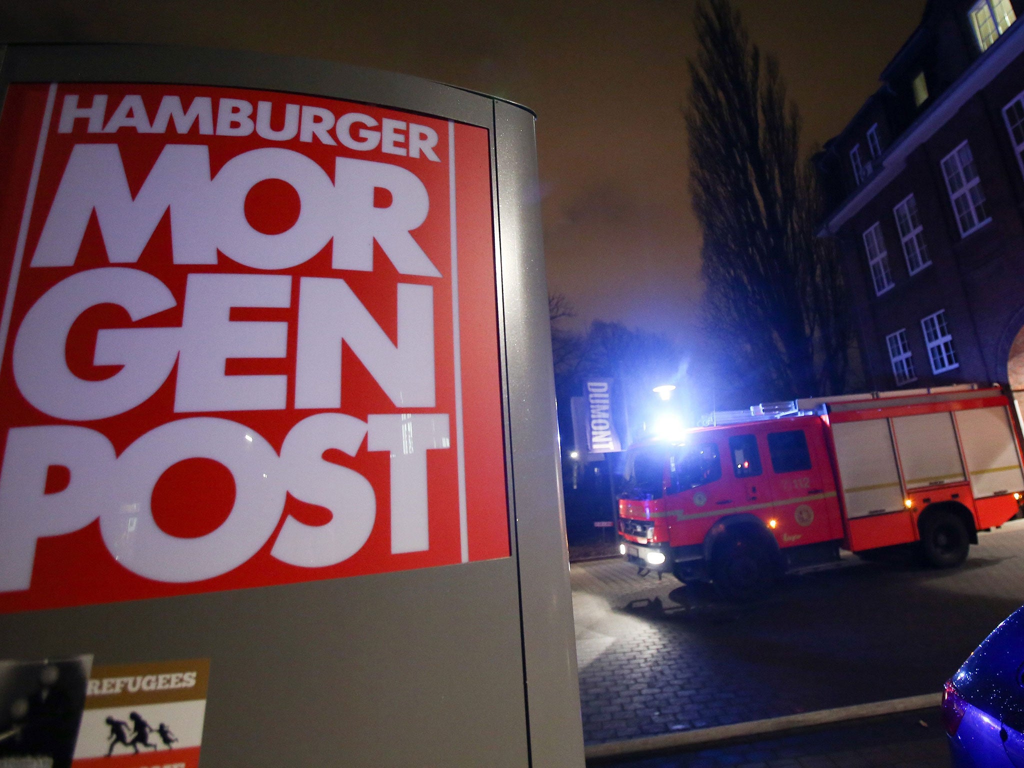 A firefighters truck is seen in front of the headquarters of German daily Hamburger Morgenpost (MoPo) after an arson attack on parts of it's archive