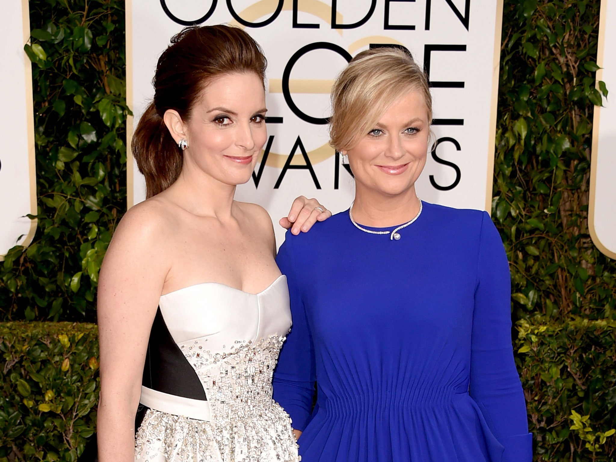 Tina Fey and Amy Poehler arrive to host the Golden Globes 2015