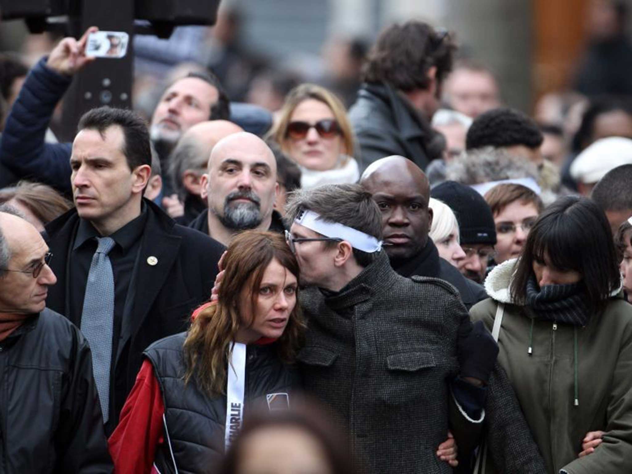 ‘Charlie Hebdo’ staff, including cartoonist Luz (Renald Luzier, wearing headband) at the march through Paris on Sunday