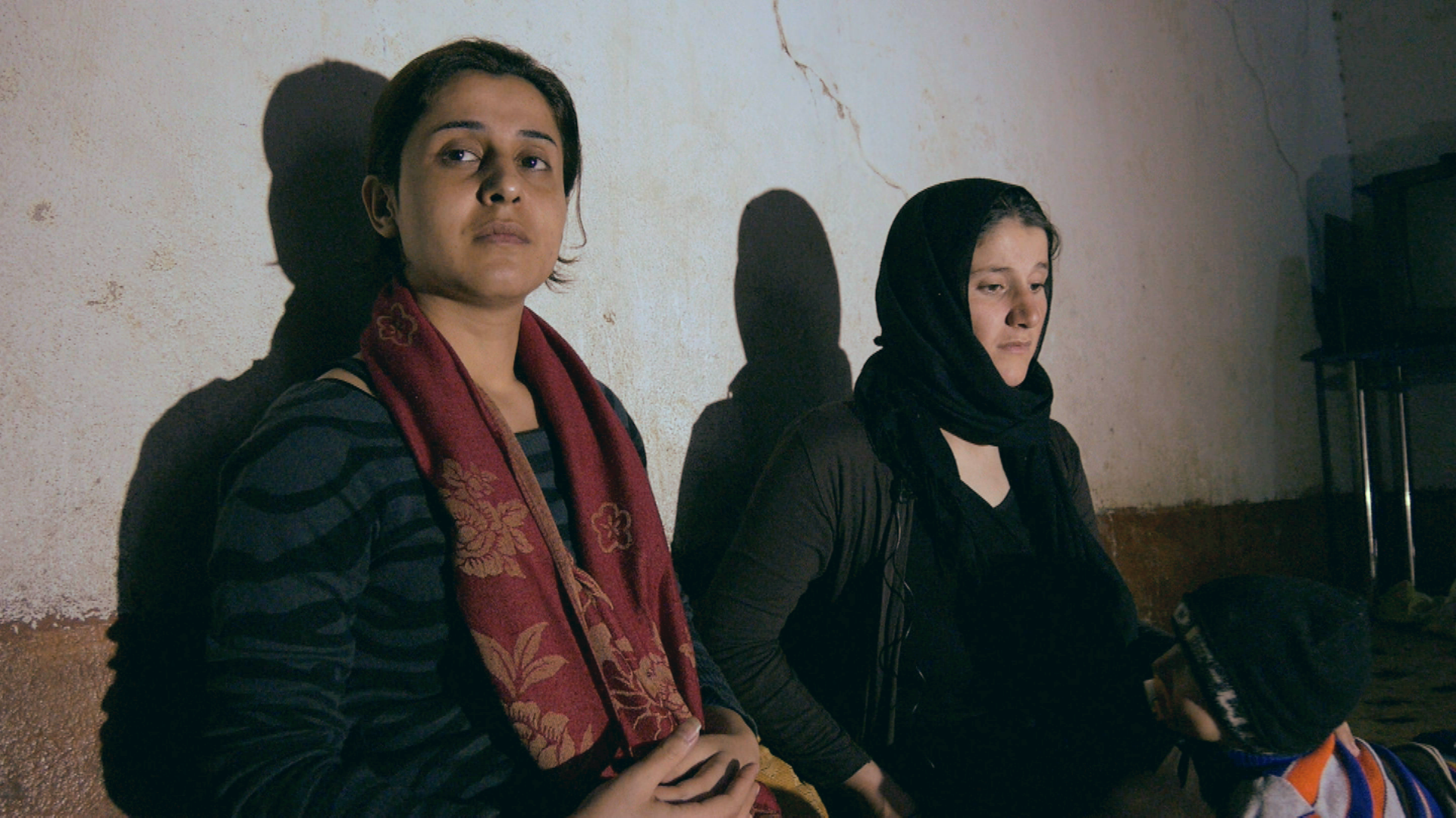 Hamshe (R) escaped Isis militants with her baby aged just 19 (Pic: BBC Arabic)