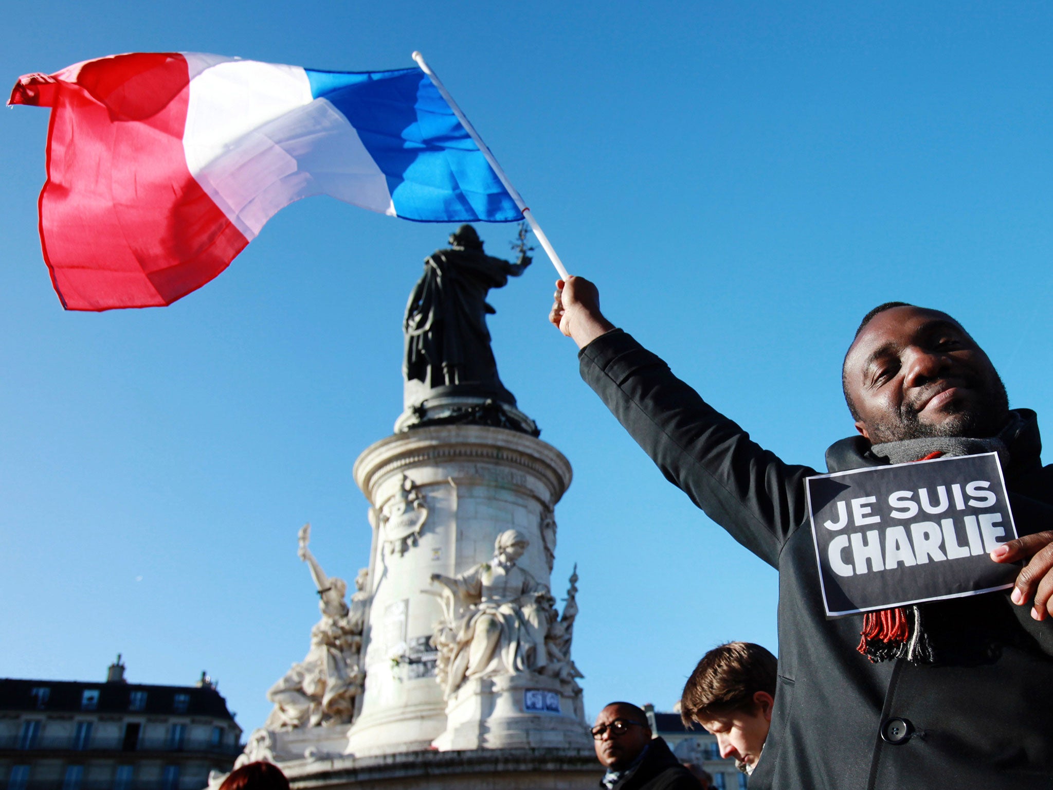 A man takes part in a Unity rally in tribute to the 17 victims of a three-day killing spree by extremist Islamists.