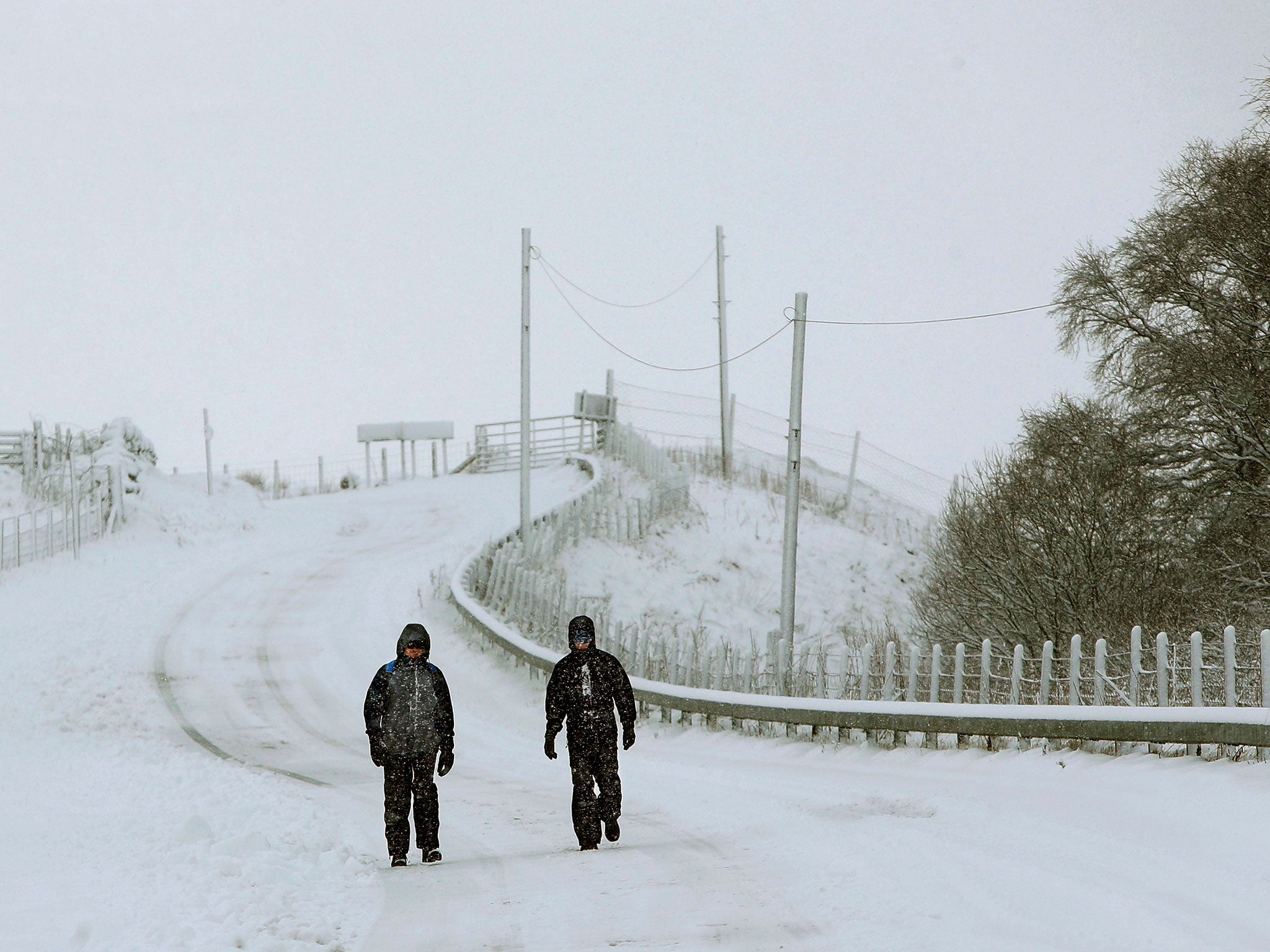 Andrew Millington (left) and Stephen Peacock walk near the Spittal of Glenshee as snow brings fresh disruption to parts of the UK