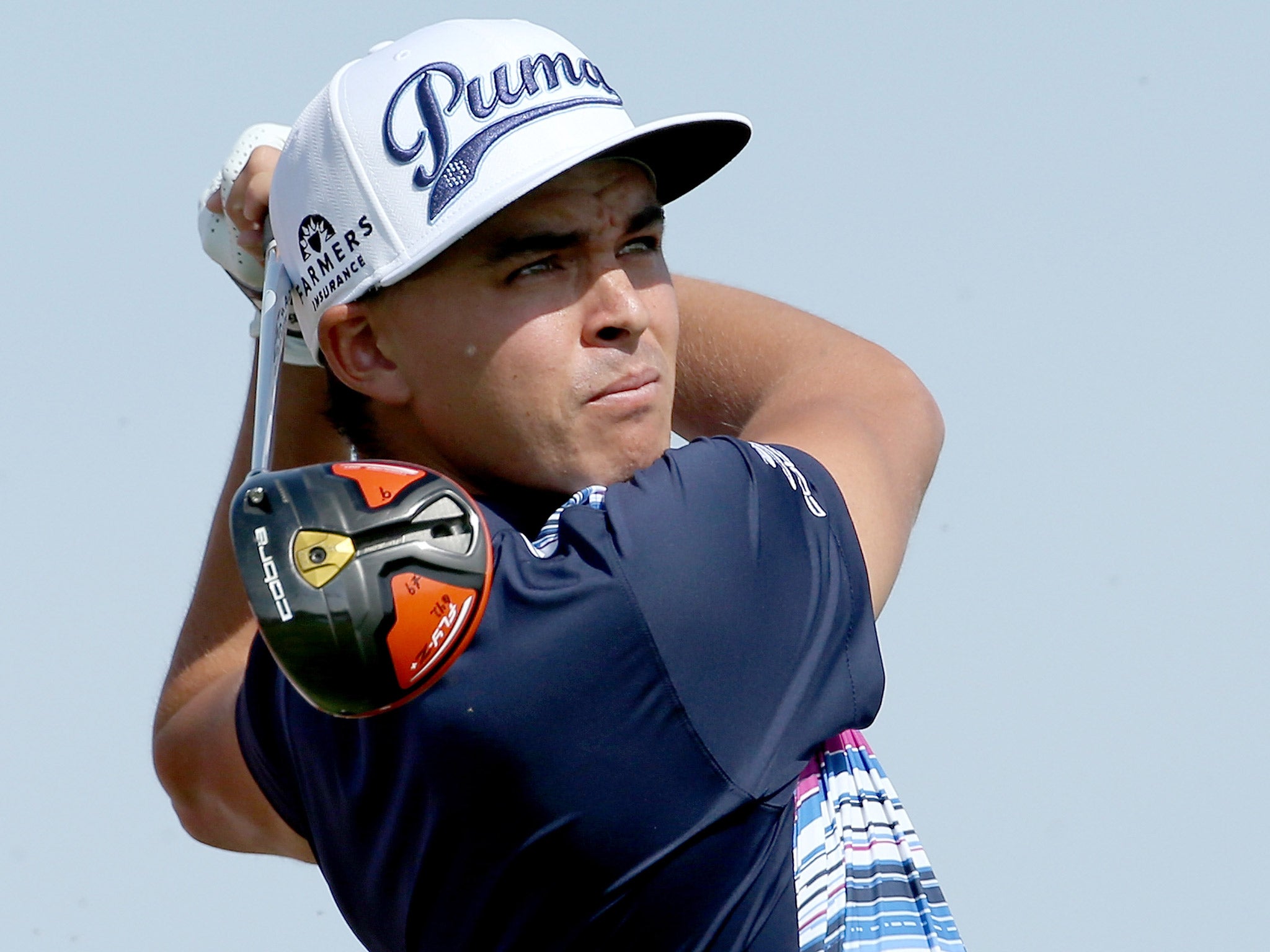 Rickie Fowler watches his drive in Abu Dhabi