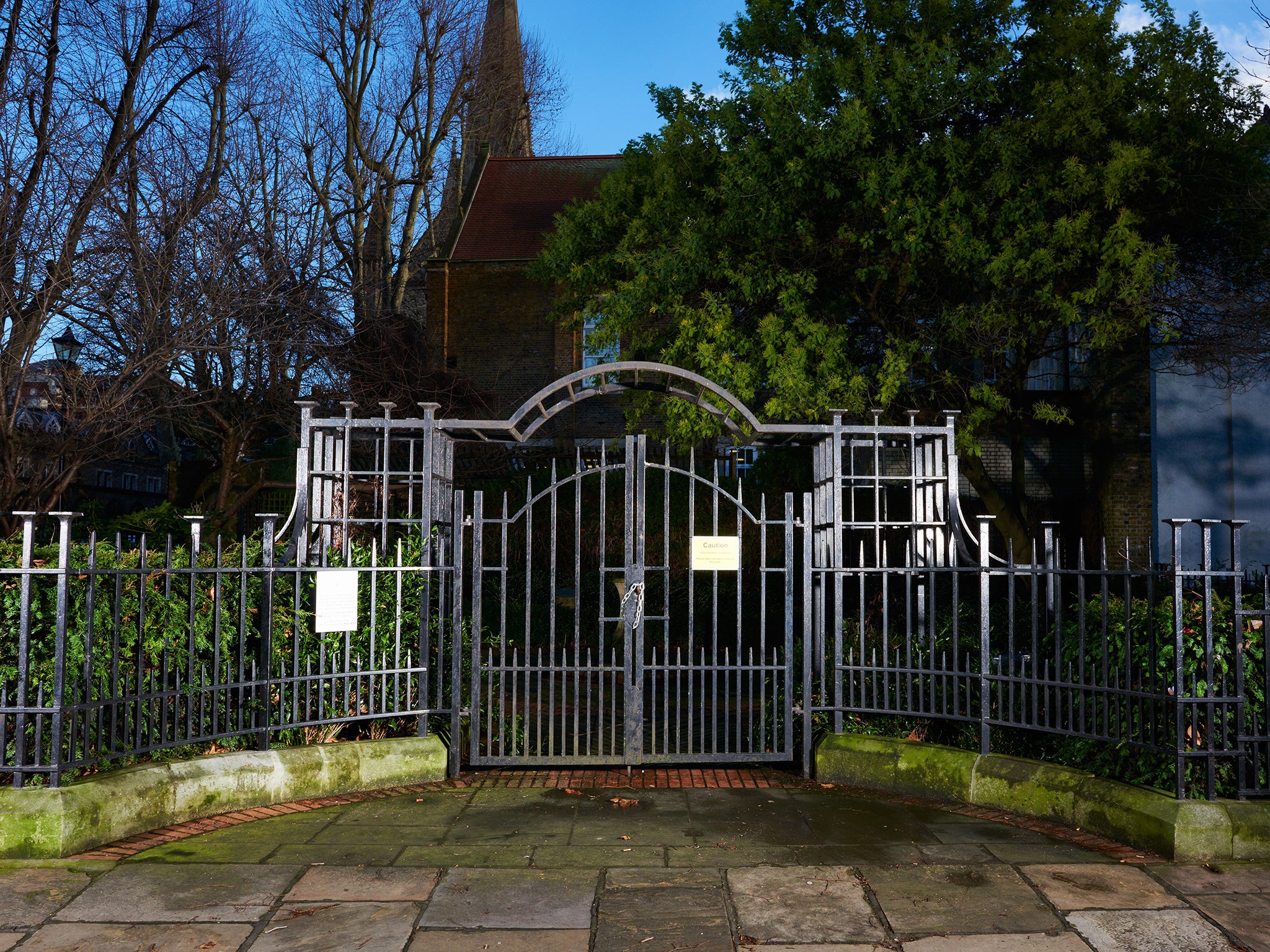 The park railings of a local park in Kensington where a homeless man died