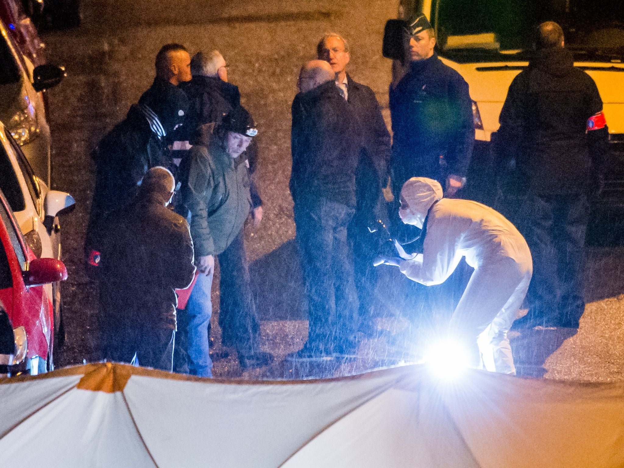 Police investigate a shootout in a street in Verviers, Belgium