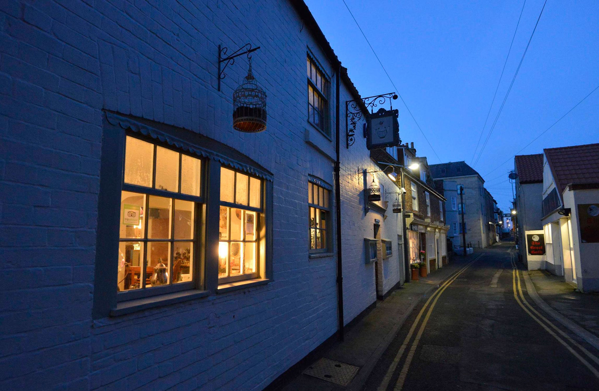 Rusty Shears has windows crammed with weird old scientific gubbins and a sign reading 'Licensed to sell amazing cakes'