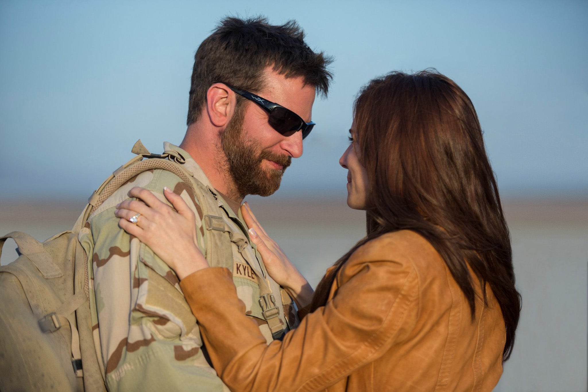 Bradley Cooper and Sienna Miller star as Chris and Taya Kyle in American Sniper