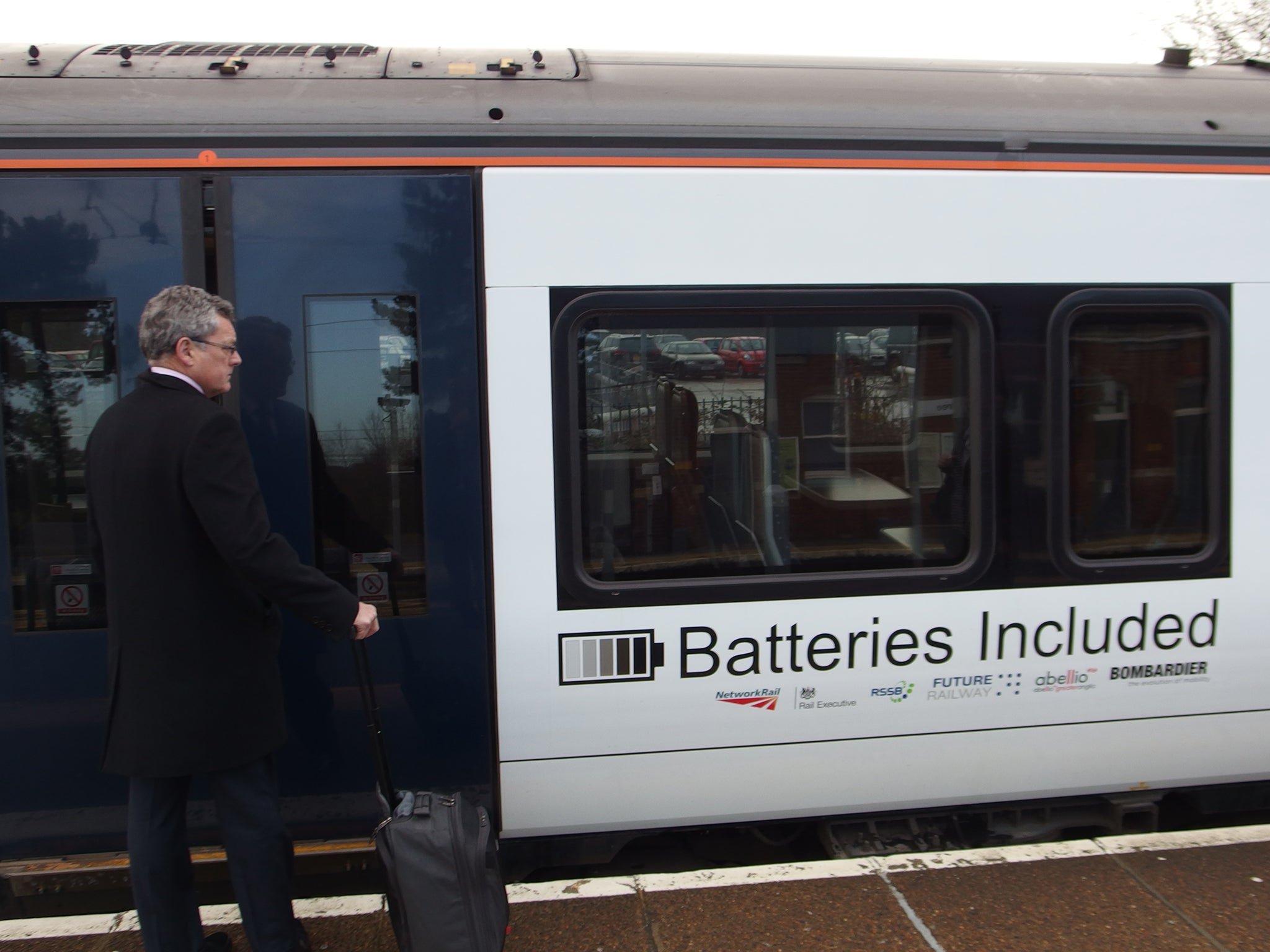 A passenger boards the train