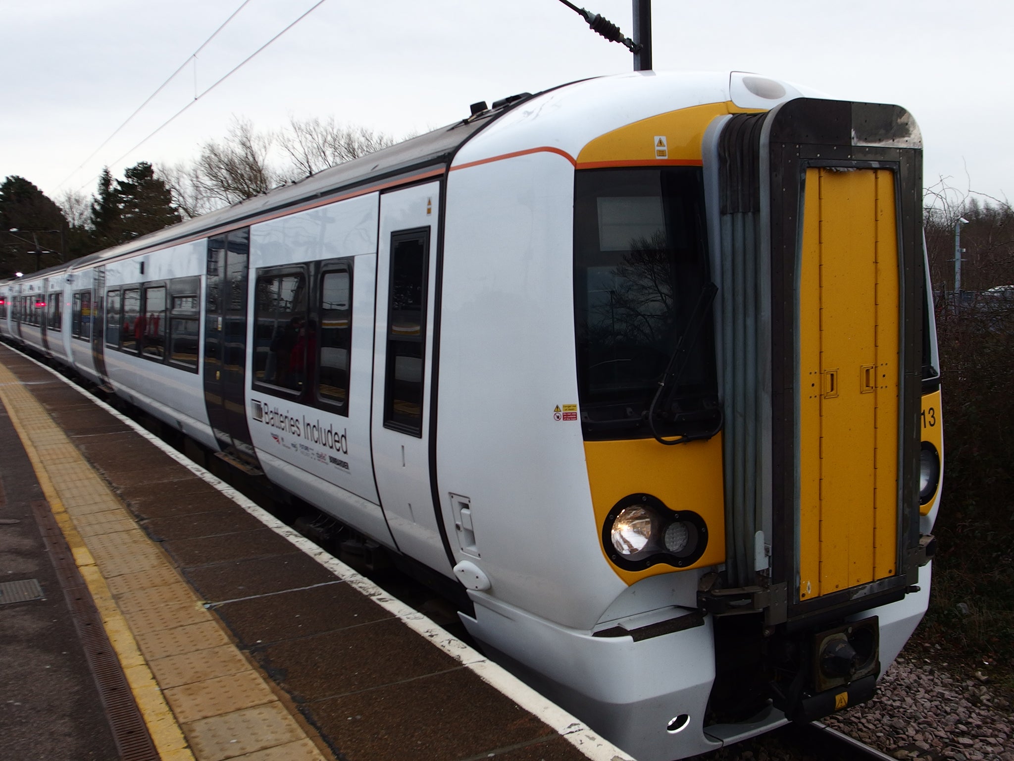 The batter-powered train pulls into the station