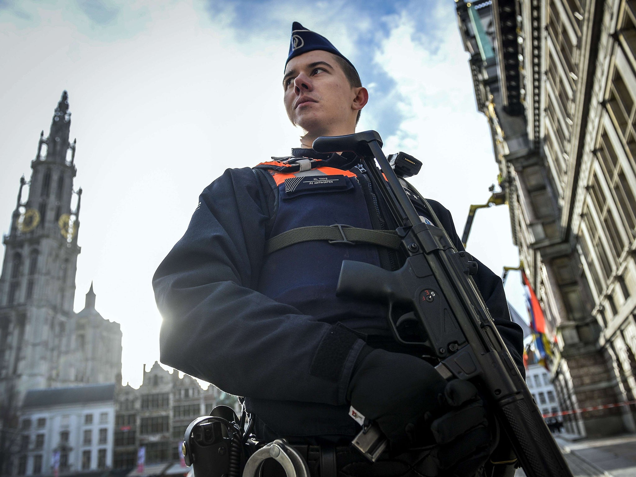 A police officer in front of Antwerp cathedral yesterday