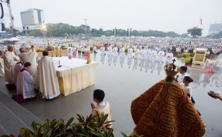 The Pope leading the huge outdoor Mass session