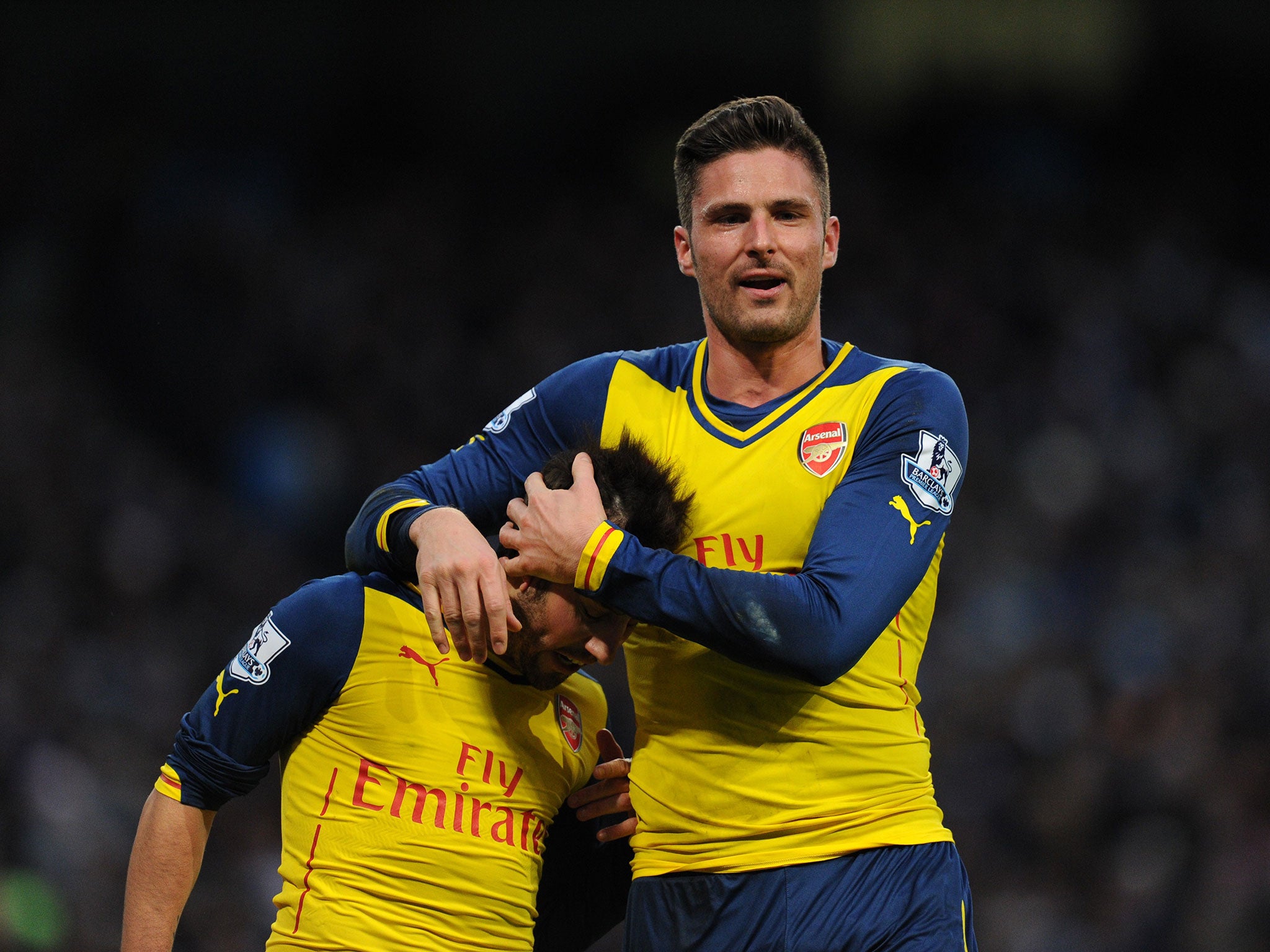 Olivier Giroud (right) and Santi Cazorla