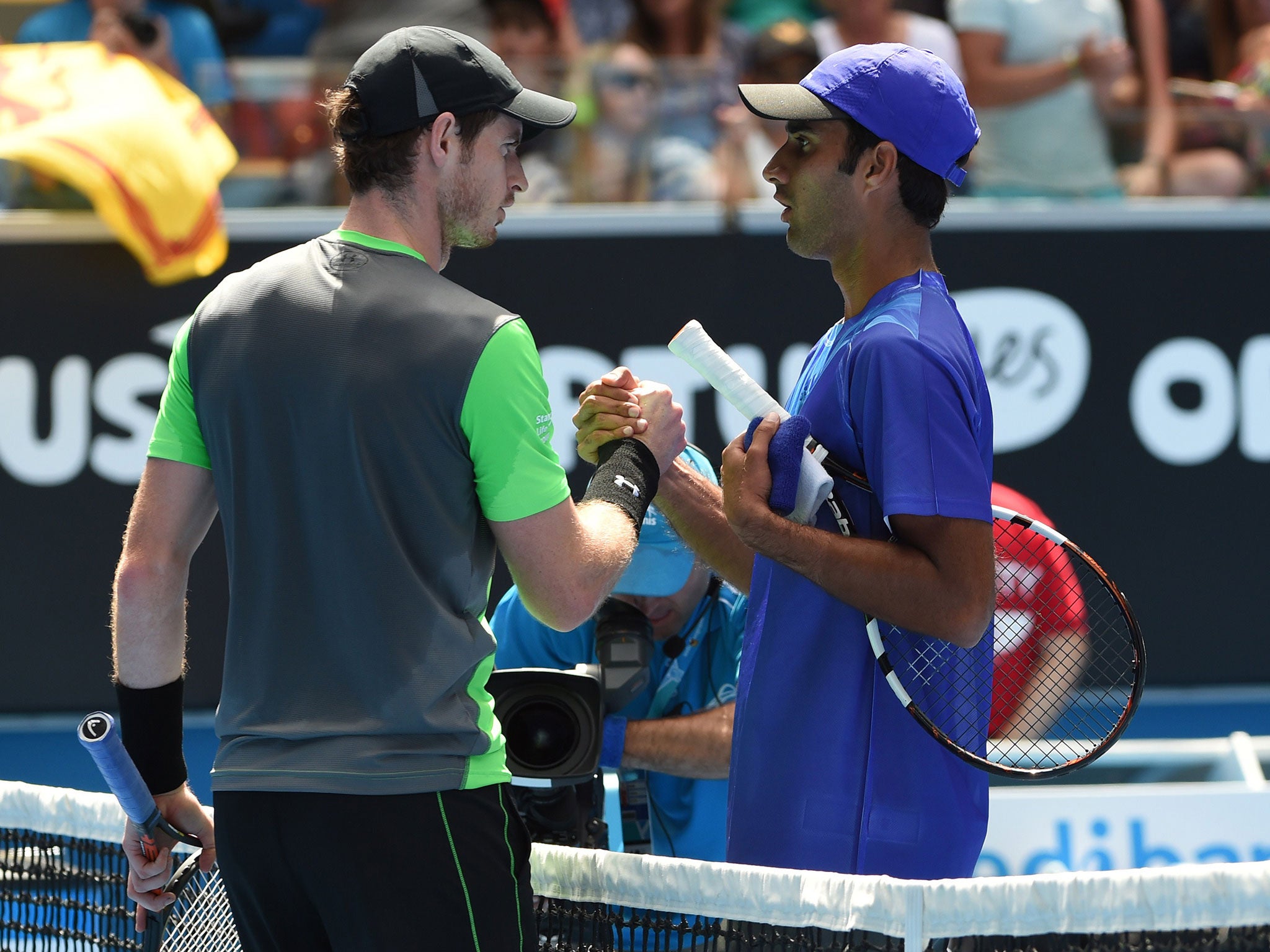 Andy Murray and Yuri Bhambri shake hands after the former's first round victory