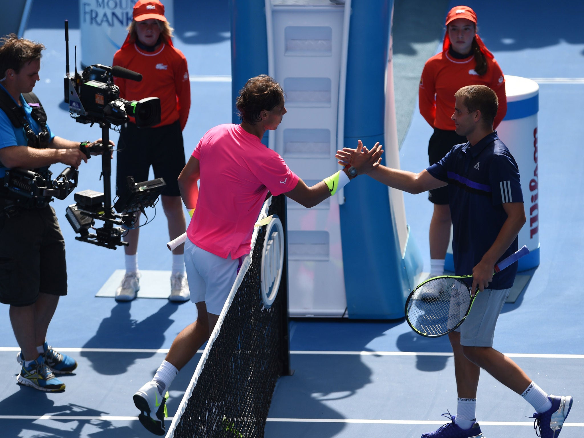 Rafael Nadal shakes hands with Mikhail Youzhny after his first round victory