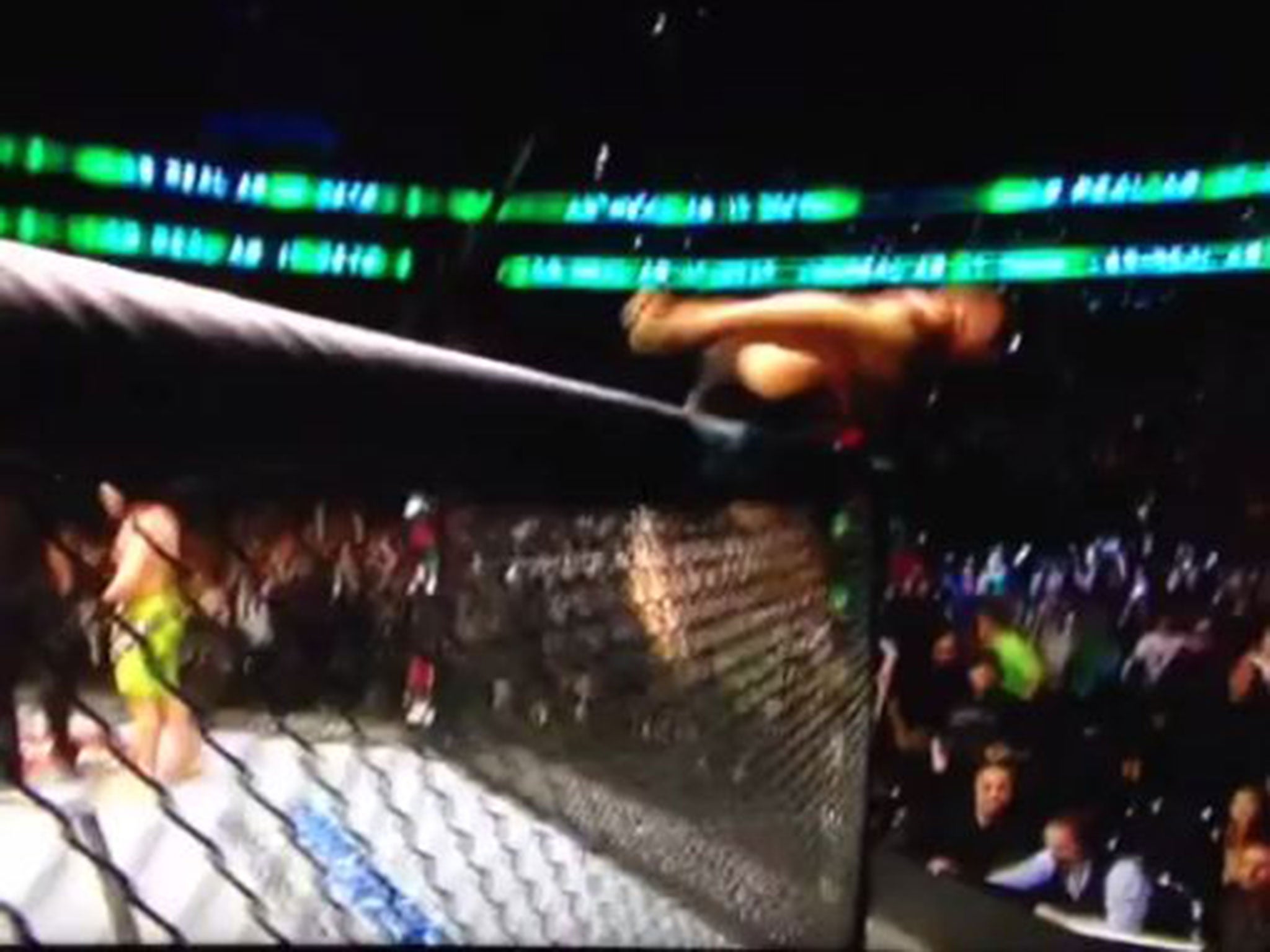 McGregor hurdles over the Octagon wall to confront Jose Aldo