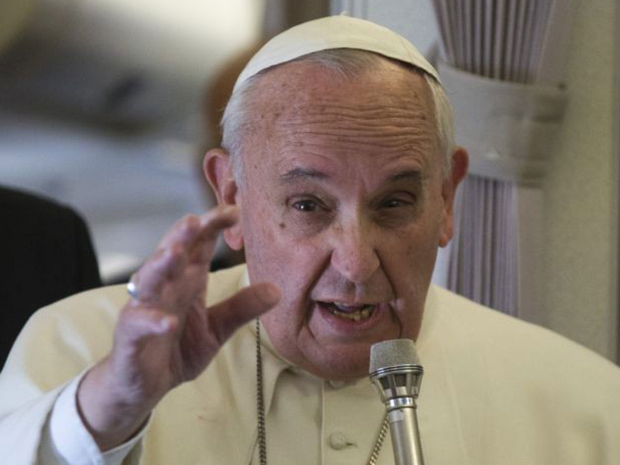 Pope Francis talks with journalists during his flight from Manila to Rome