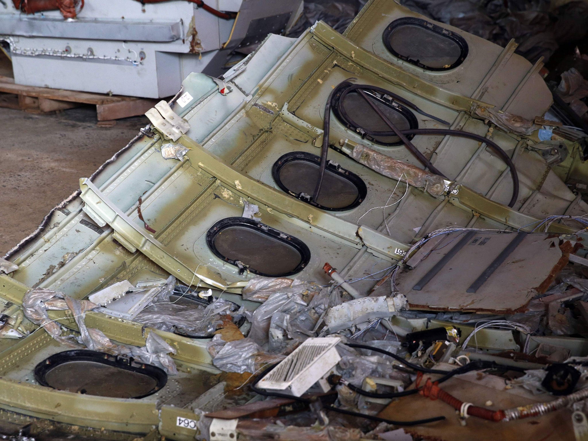 Part of the fuselage of AirAsia Flight QZ8501 inside a storage facility at Kumai port in Pangkalan Bun, on 19 January, 2015