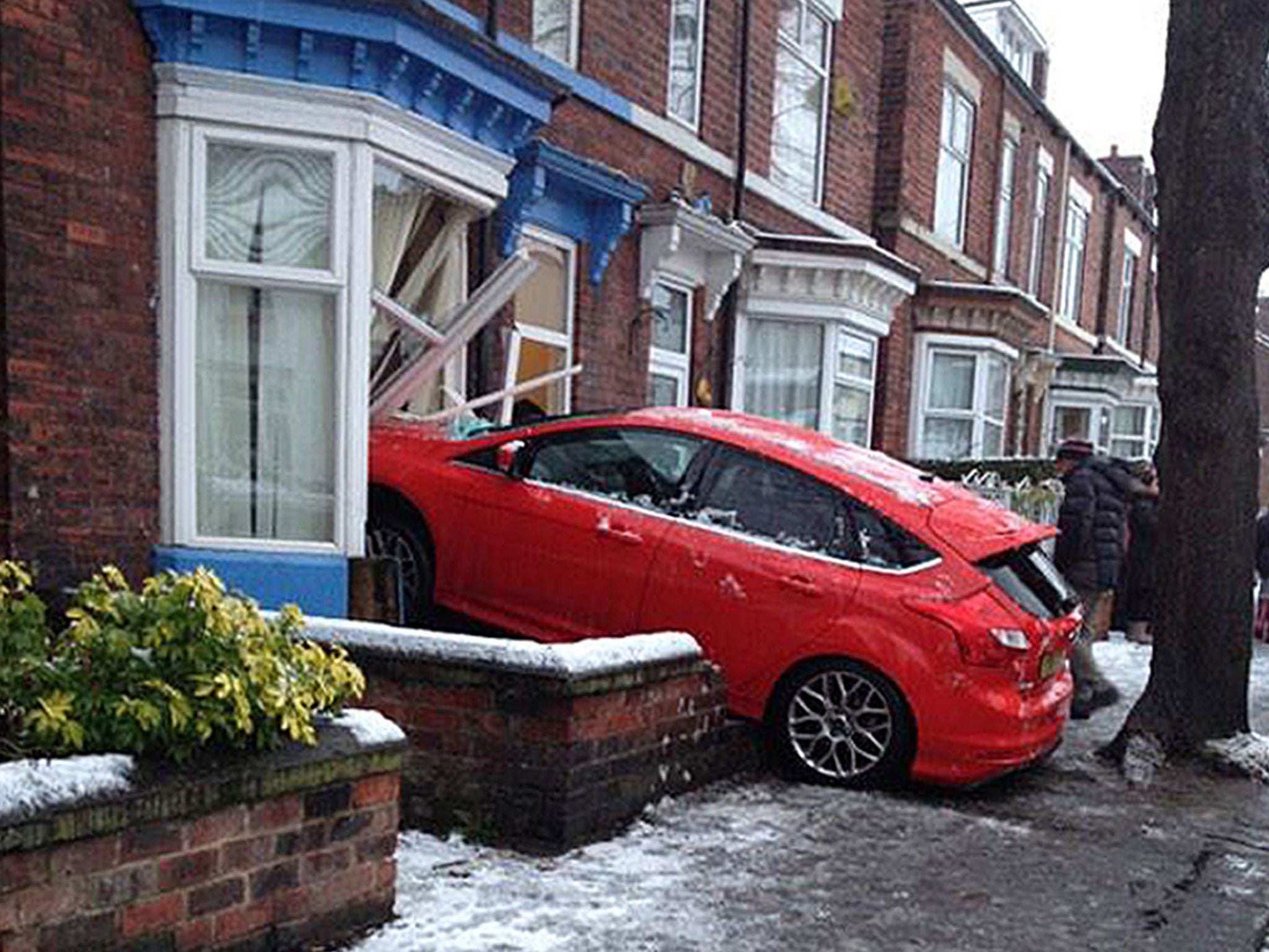 A car after it crashed into a house in Sheffield in the snow.