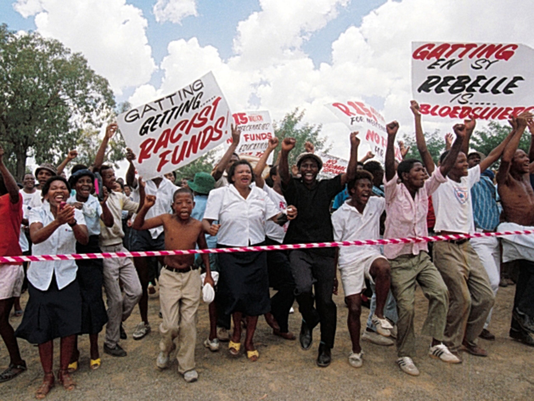 People protest at Springbok Park in Bloemfontein during the match between South Africa Universities and the England XI