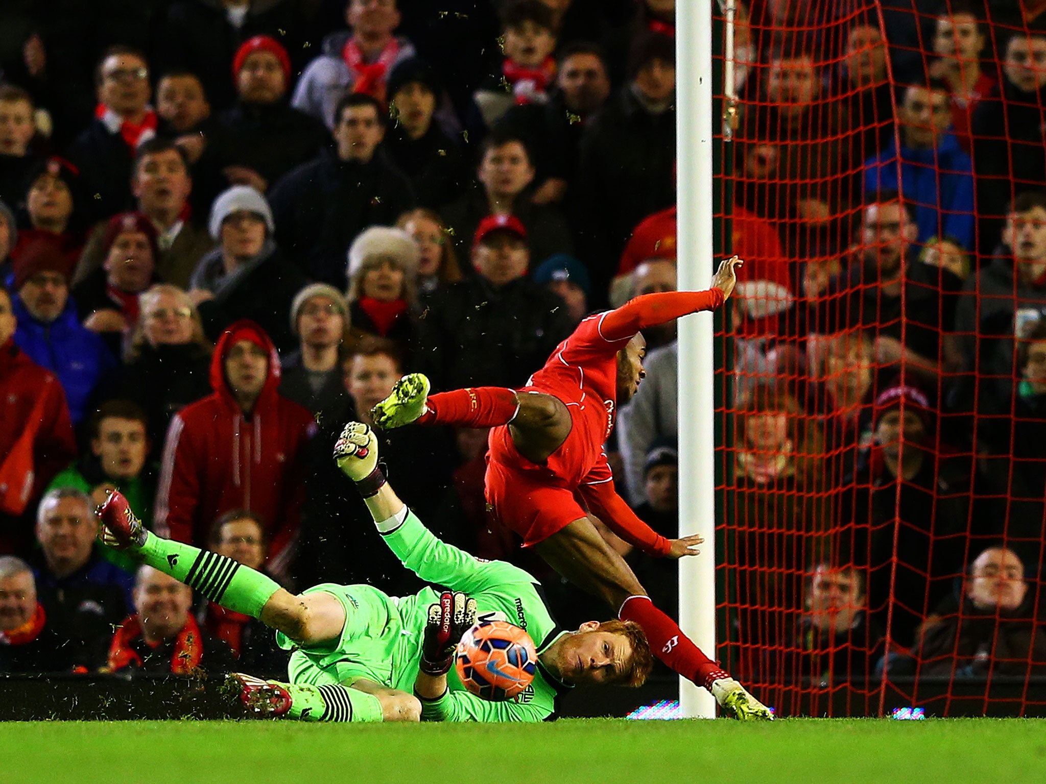 Adam Bogdan saves from Raheem Sterling