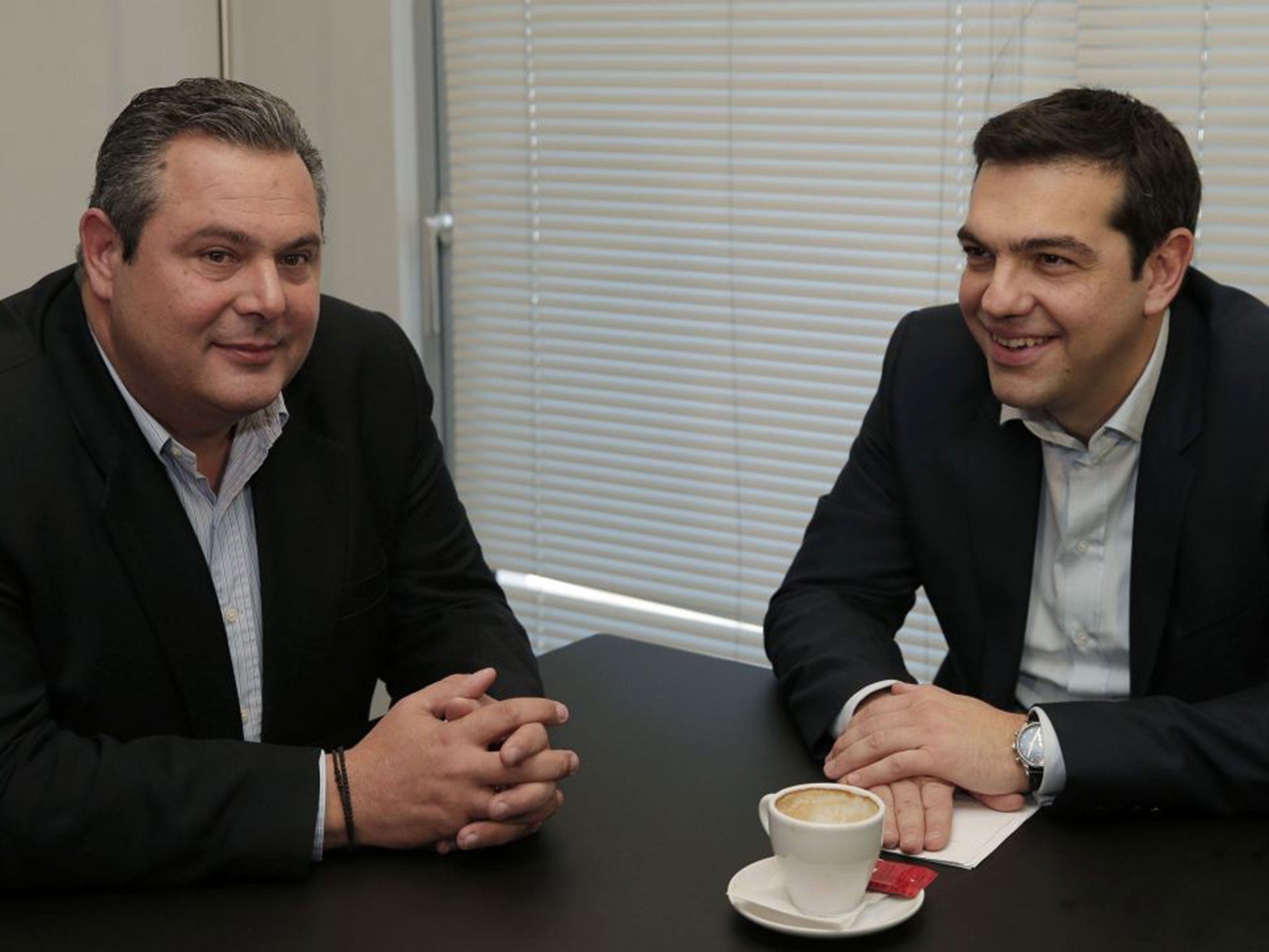 Alexis Tsipras, right, leader of Greece's left-wing main opposition Syriza party, and Panos Kammenos, chairman of the right-wing Independent Greeks party