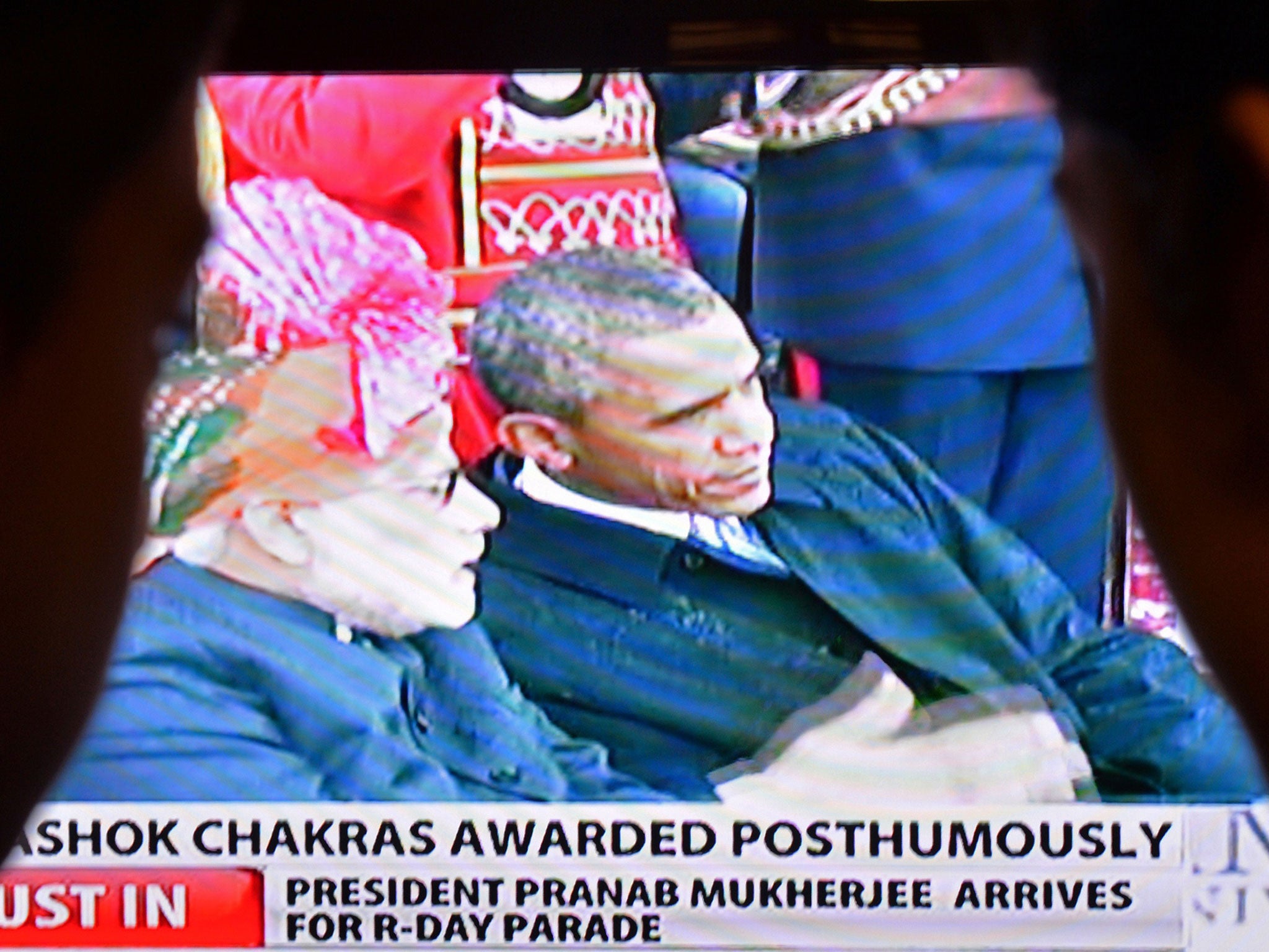 Indian viewers watch a broadcast of Indian Prime Minister Narendra Modi and US President Barack Obama at Republic Day celebrations.