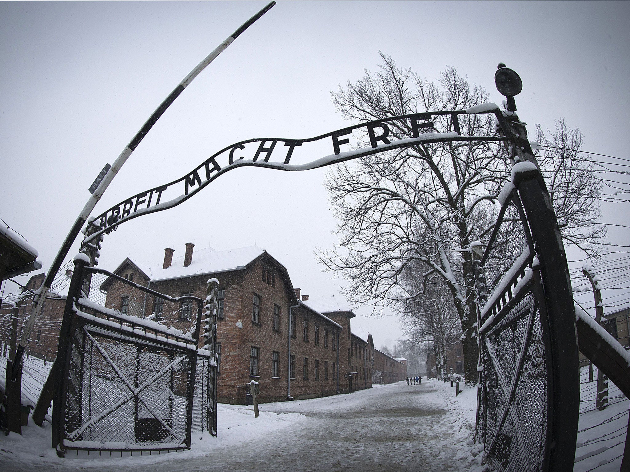 The infamous entrance to the former Nazi concentration camp Auschwitz-Birkenau with the lettering 'Arbeit macht frei' ('Work makes you free')