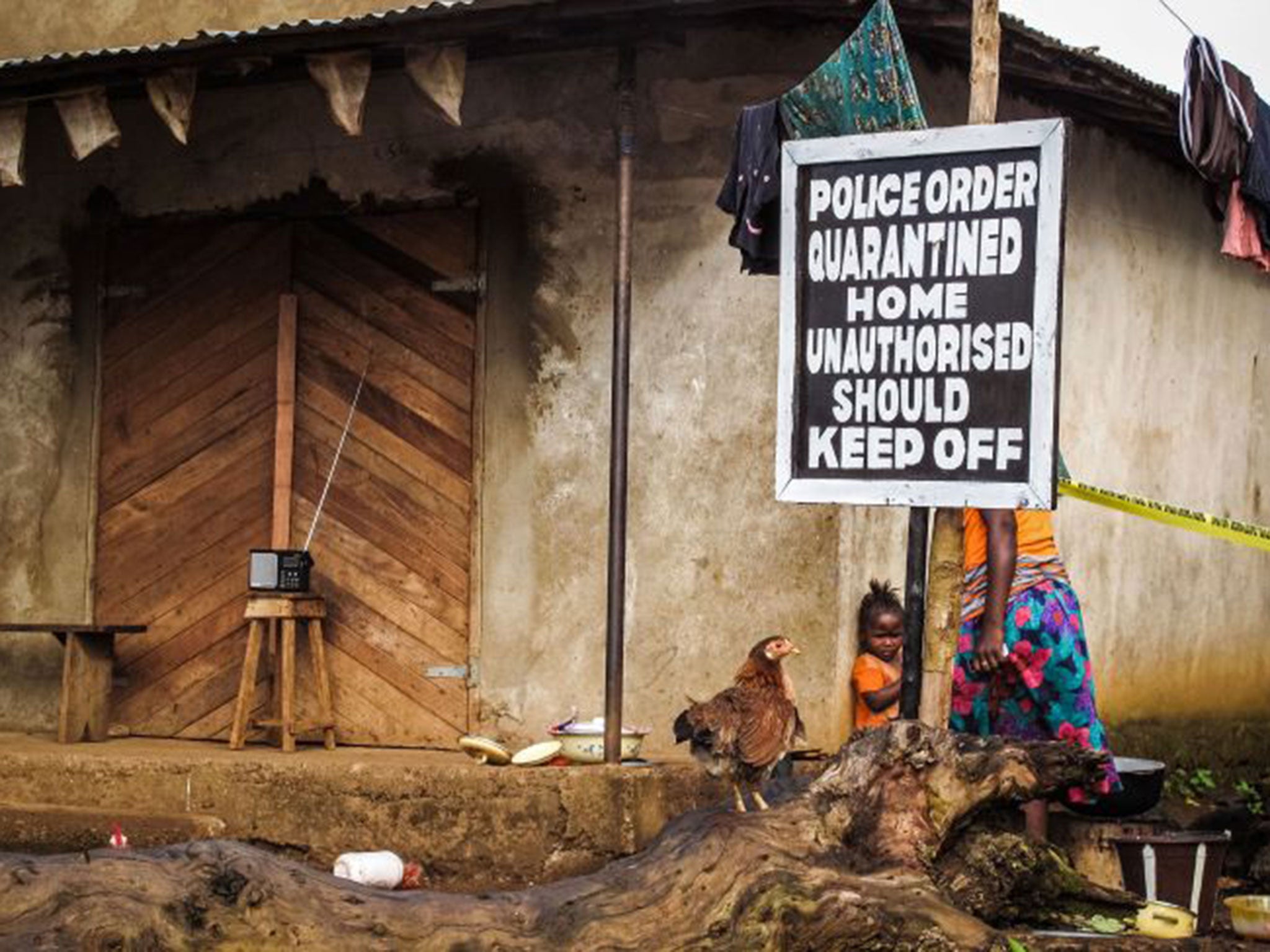 Reminders of Ebola’s terrifying spread through the region are everywhere. In Port Loko district in Sierra Leone, a sign advises passers-by about a quarantined home