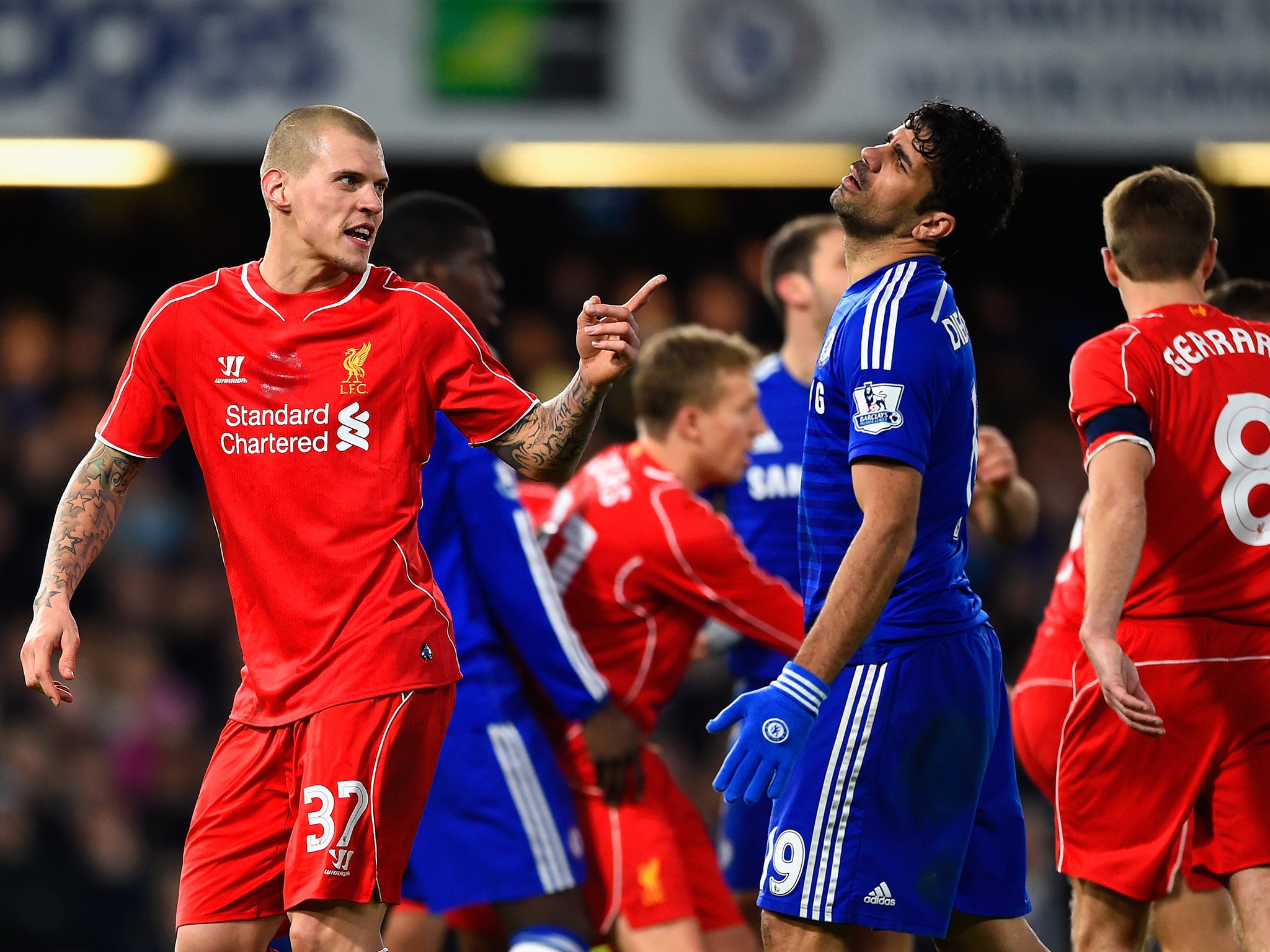 Skrtel reacts to the challenge from Costa