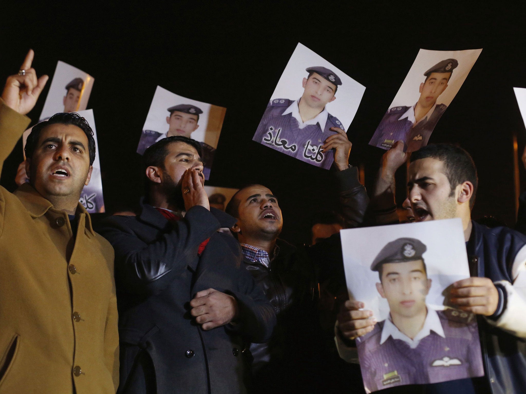 About 200 of Muath al-Kasaesbeh's relatives protested outside the prime minister's office in the Jordanian capital Amman