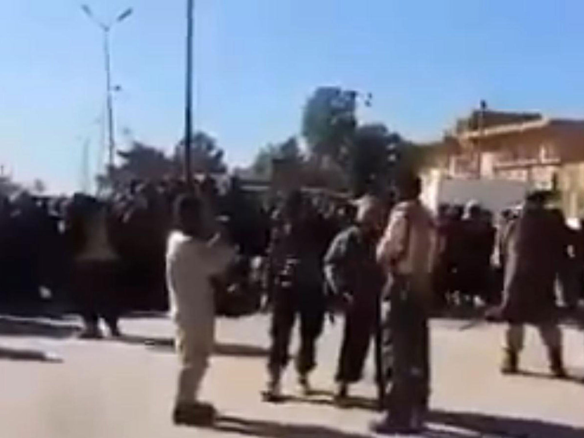 Isis militants beheaded the man publicly after posing for cameras, in Al-Shadadi, Syria