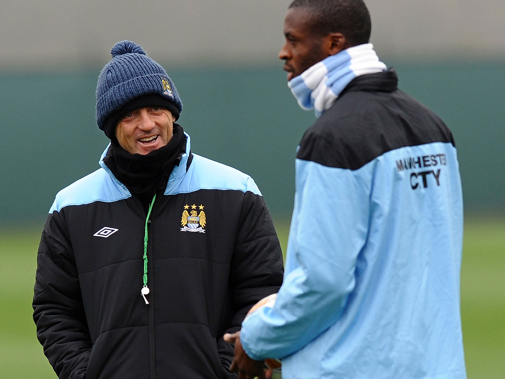 Roberto Mancini (left) and Yaya Toure during Manchester City