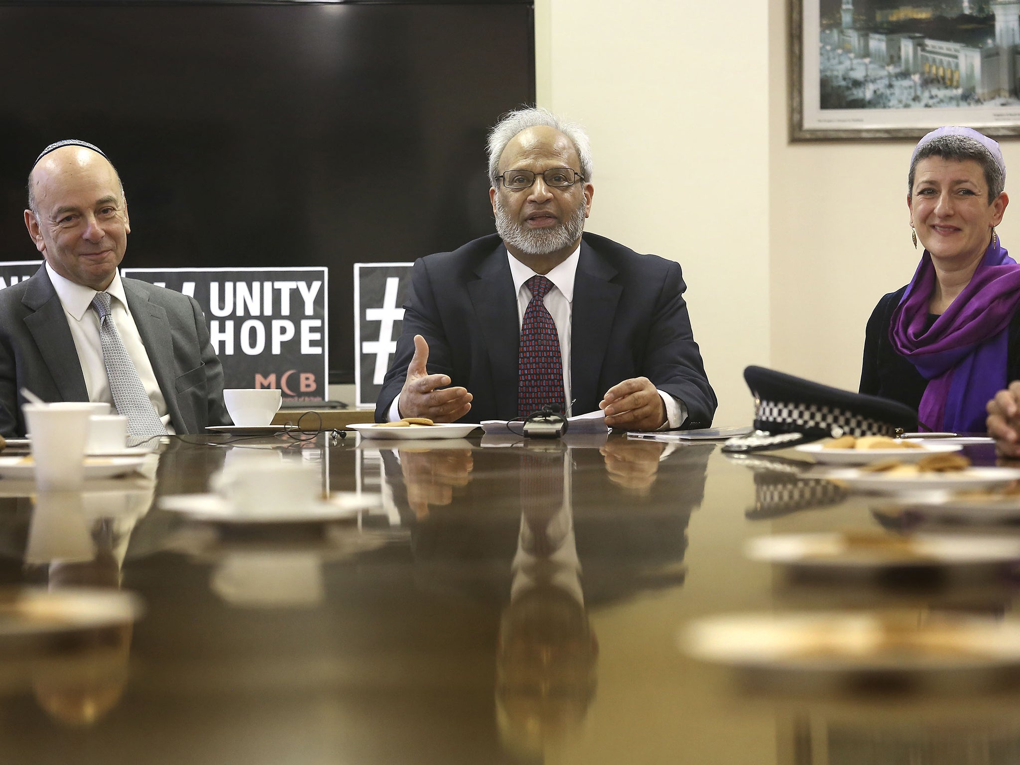 The secretary general of the Muslim Council of Britain Dr Shuja Shafi (centre) told head teachers that Muslims are still happy to sign up