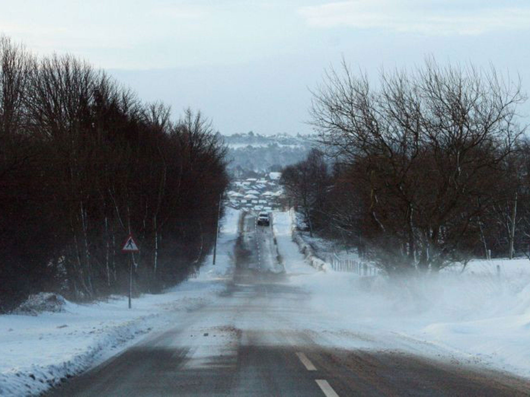 A car in the snow near Worrall, South Yorkshire