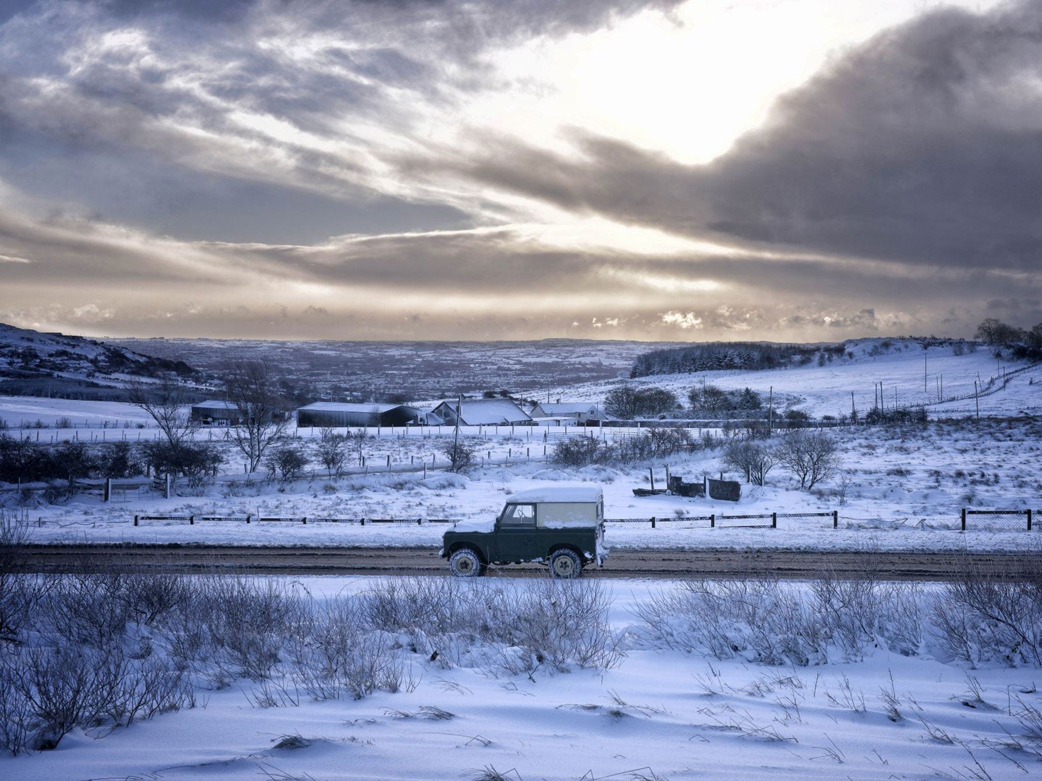 Motorists make their way over Hannahstown Hill, near Belfast (Getty)