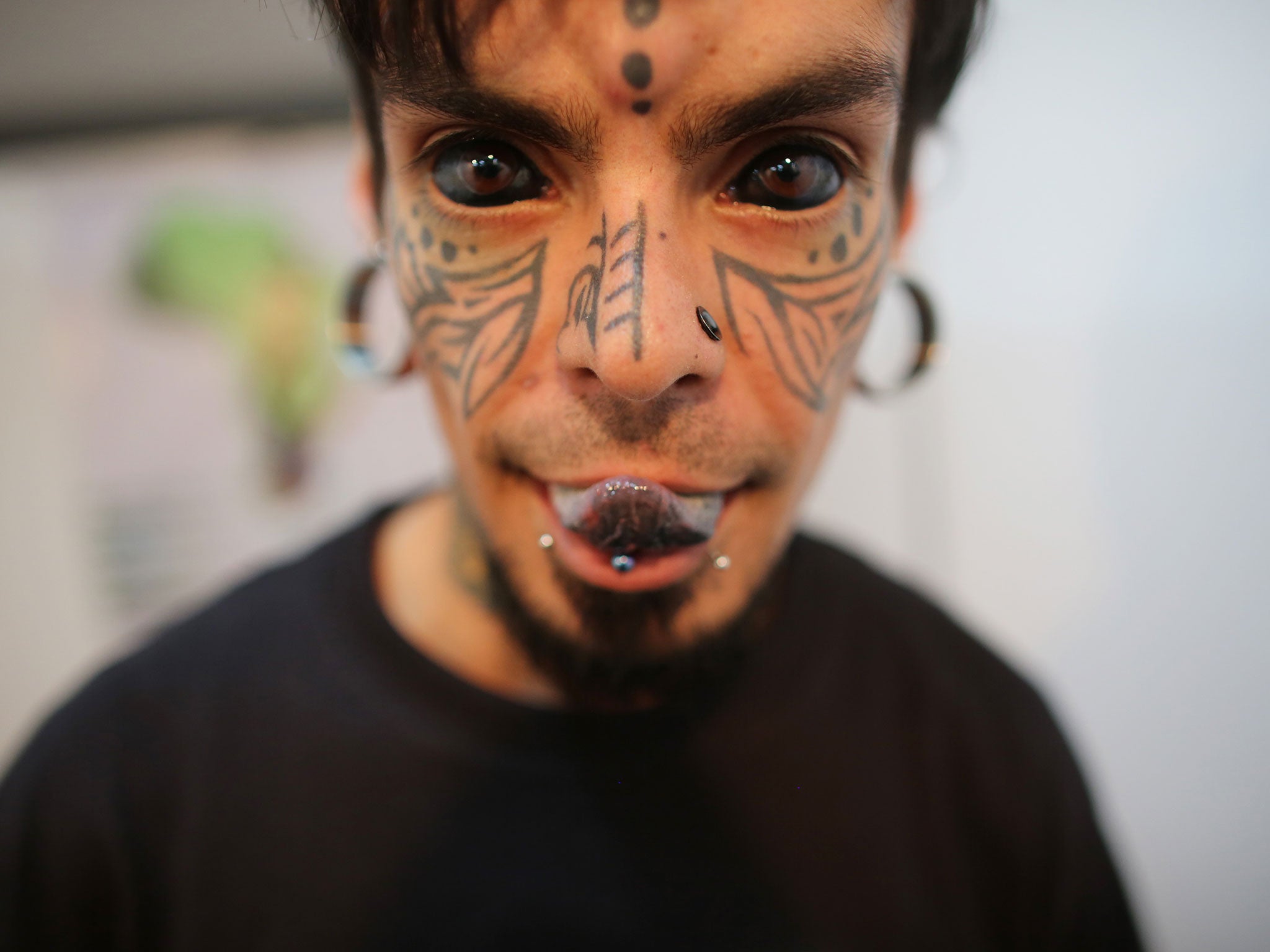 A Mexican body modification and tattoo artist known as "Vampire Woman" poses for a picture at Venezuela Expo Tattoo in Caracas