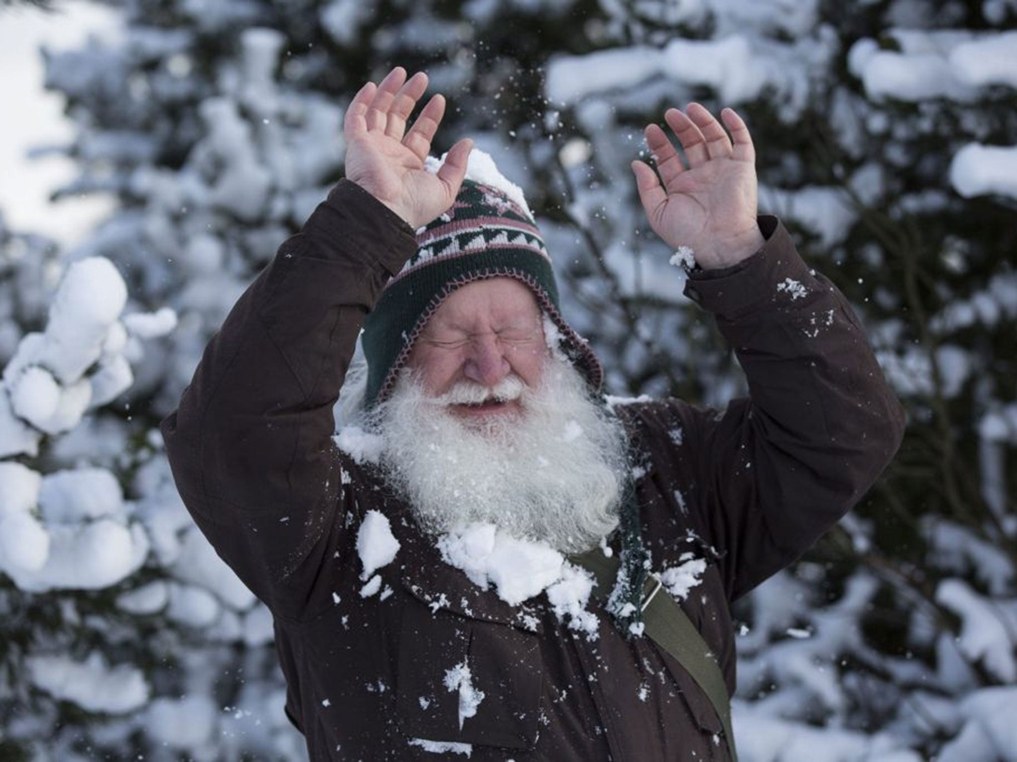 A man plays in the snow in Glasgow