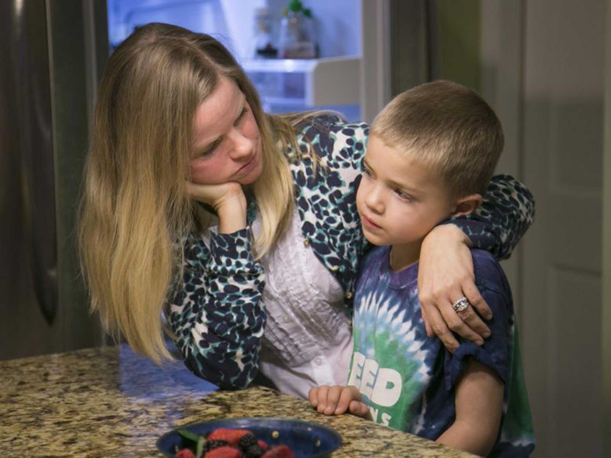 Rhett with his mother Jodi. The family are not sure whether they can risk sending him to school