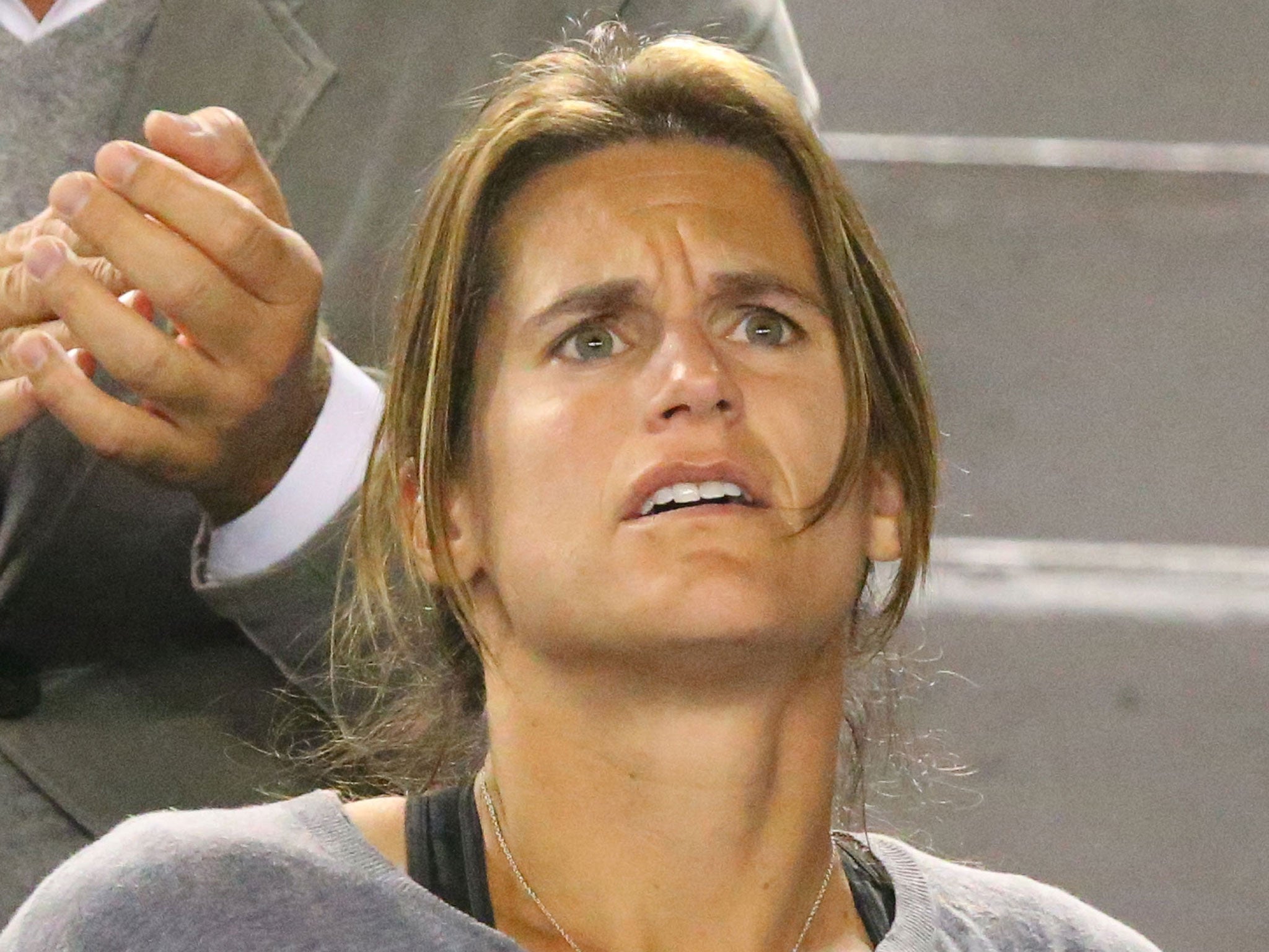 Murray's coach Amelie Mauresmo looks on in shock as Murray falters