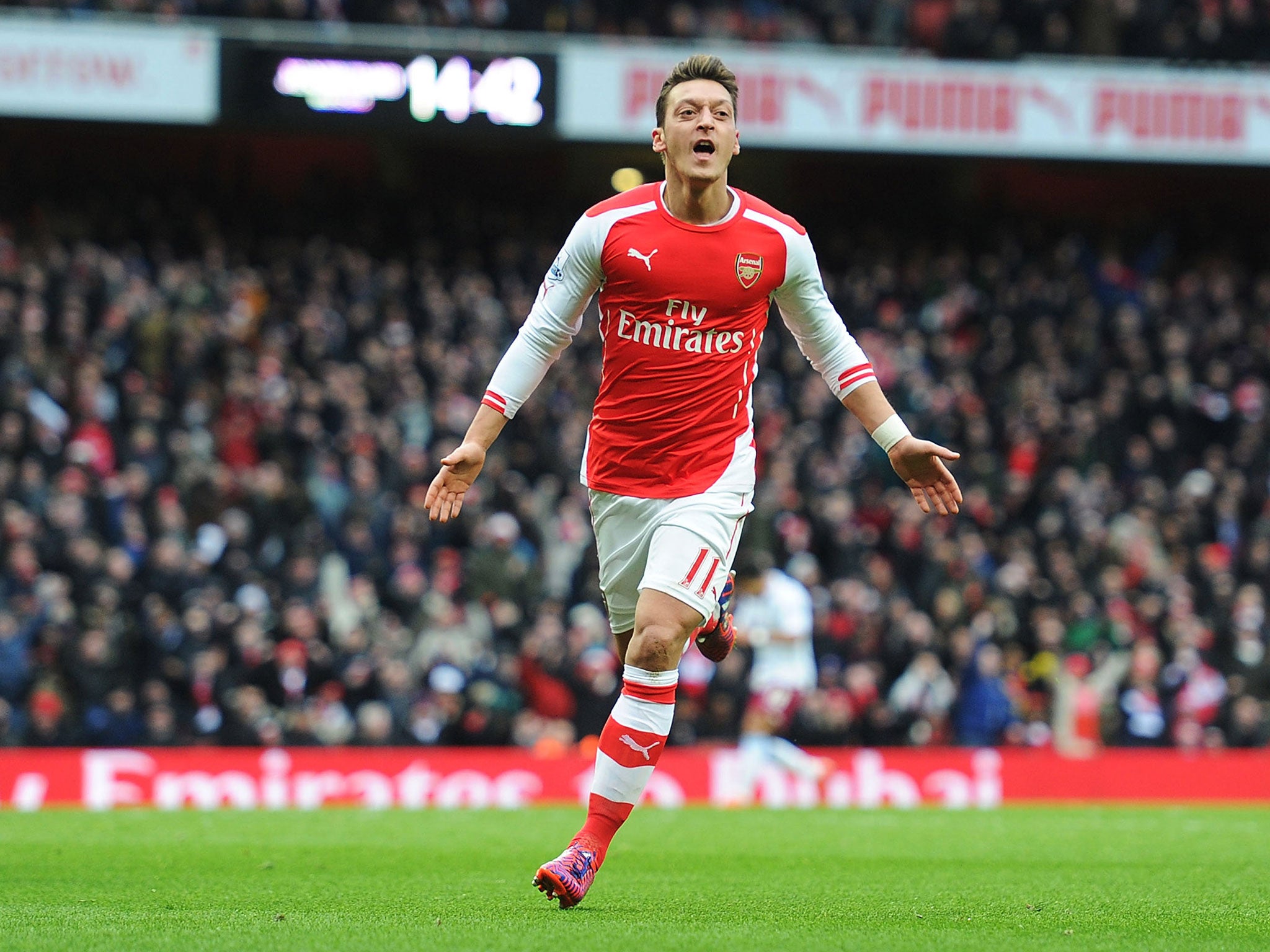 Mesut Ozil celebrates his goal